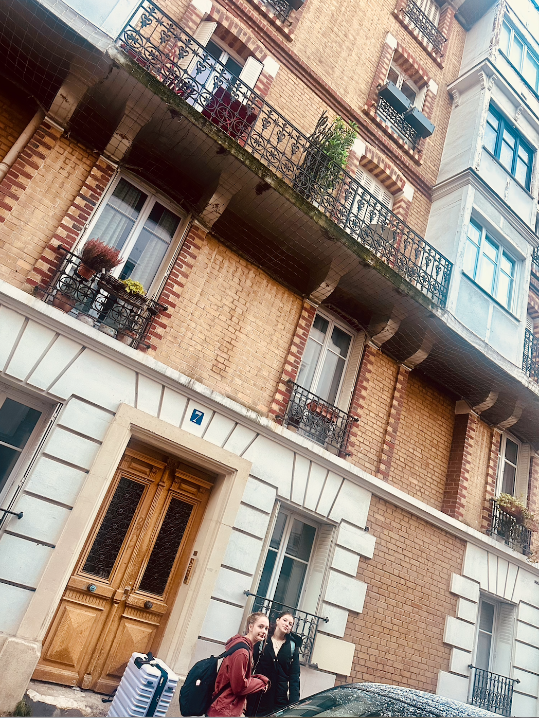 Abigail and Emerson outside Lisettes Montmartre Apartment - December 2025