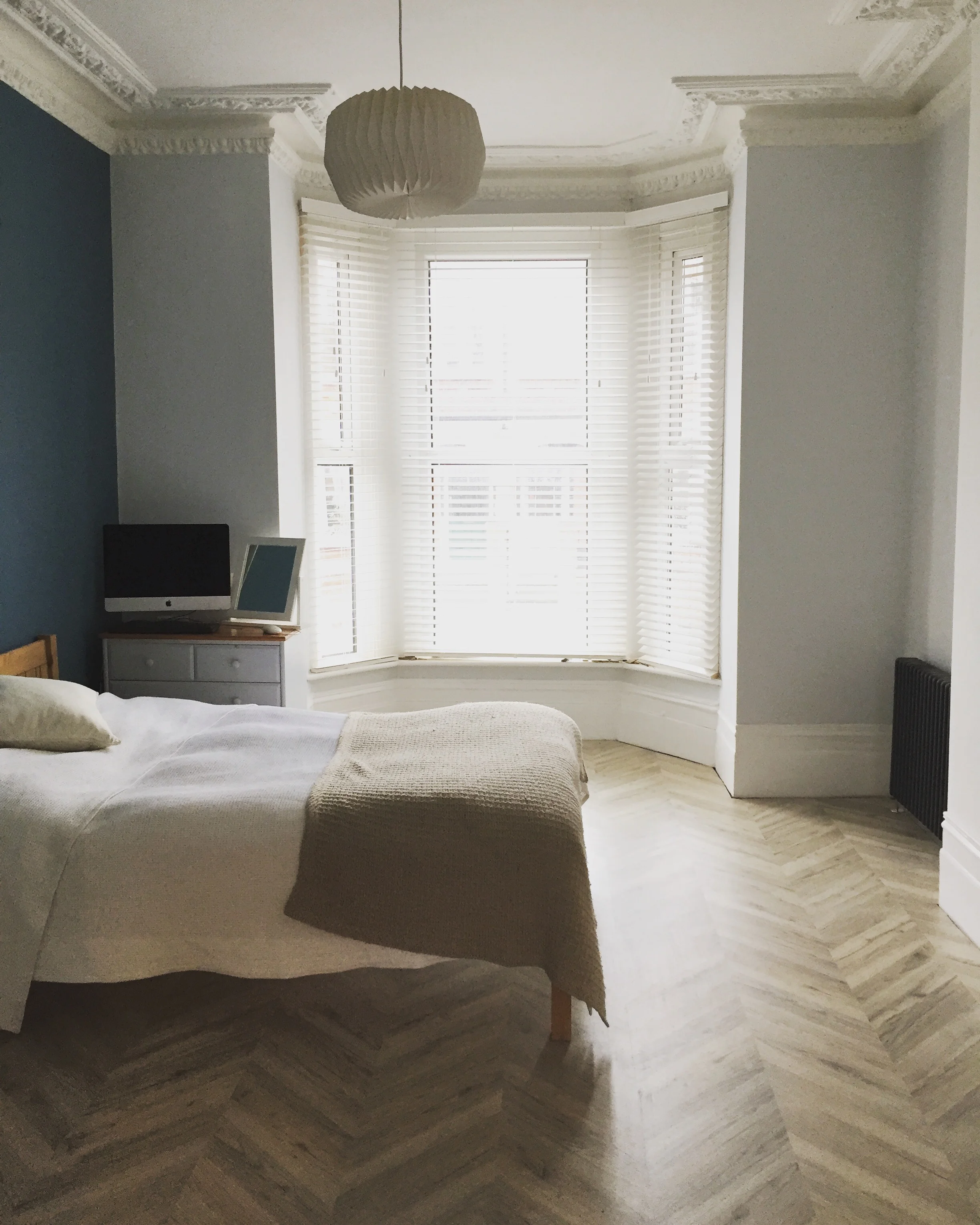   The bedroom   High ceilings, the big bay window and the original coving all brought back to life with new paint colours. 