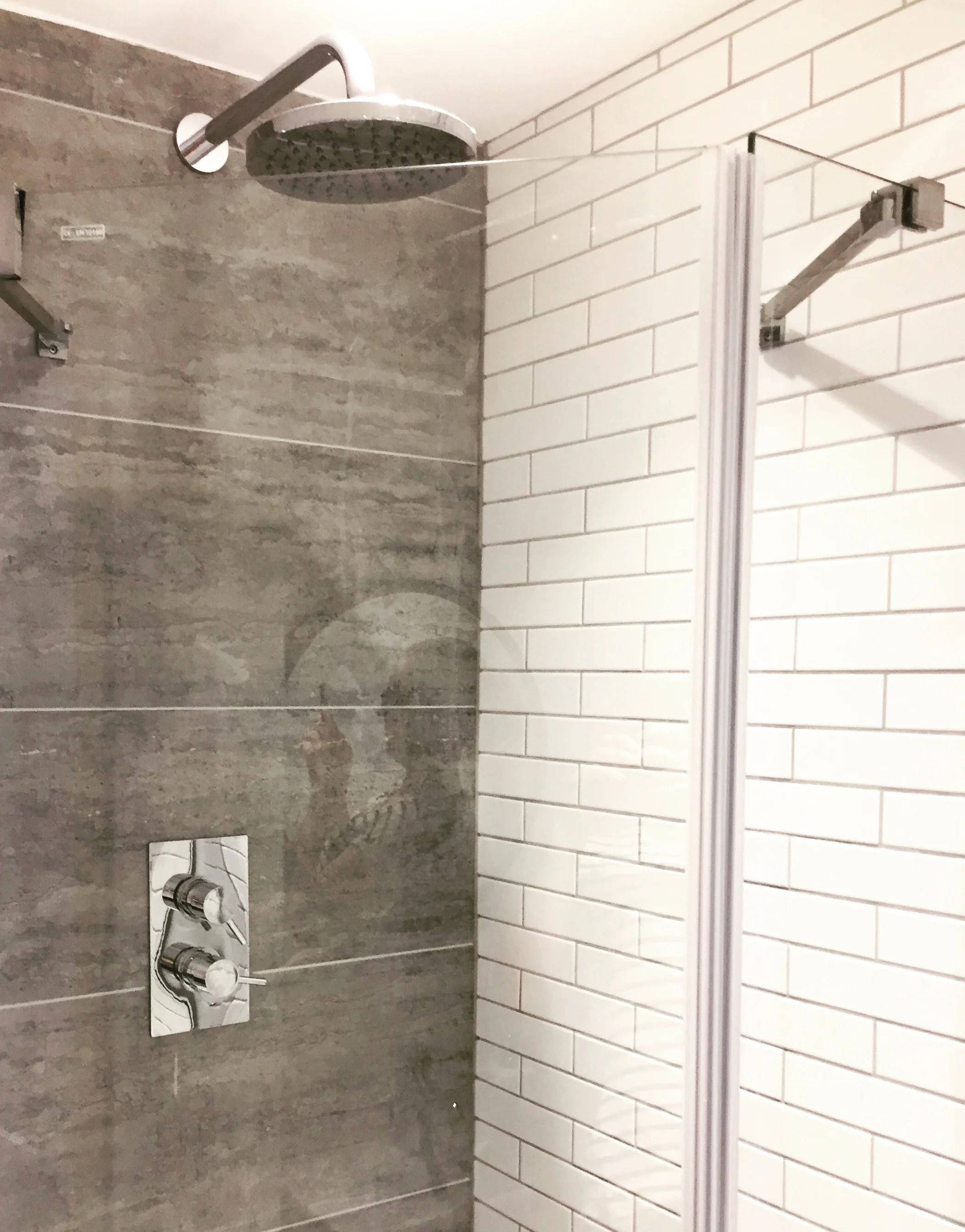   The shower   Concealed pipework within the new wall gave a minimalist look. 