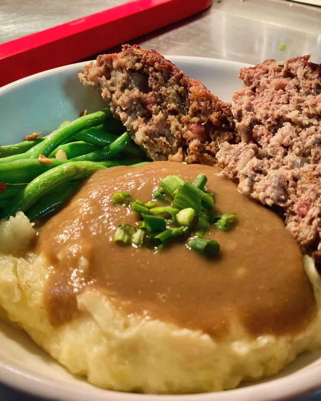 Specials this week: Fried Green Tomatoes; Mixed Veggie Pakoras; Tomato Lentil Soup; Roasted Butternut, Pepper, Caramelized Onions, and Goat Cheese Tart; Meatloaf w/ Mashed Potatoes &amp; Gravy and Garlicky Green Beans; and Raspberry Ricotta Cake. #th