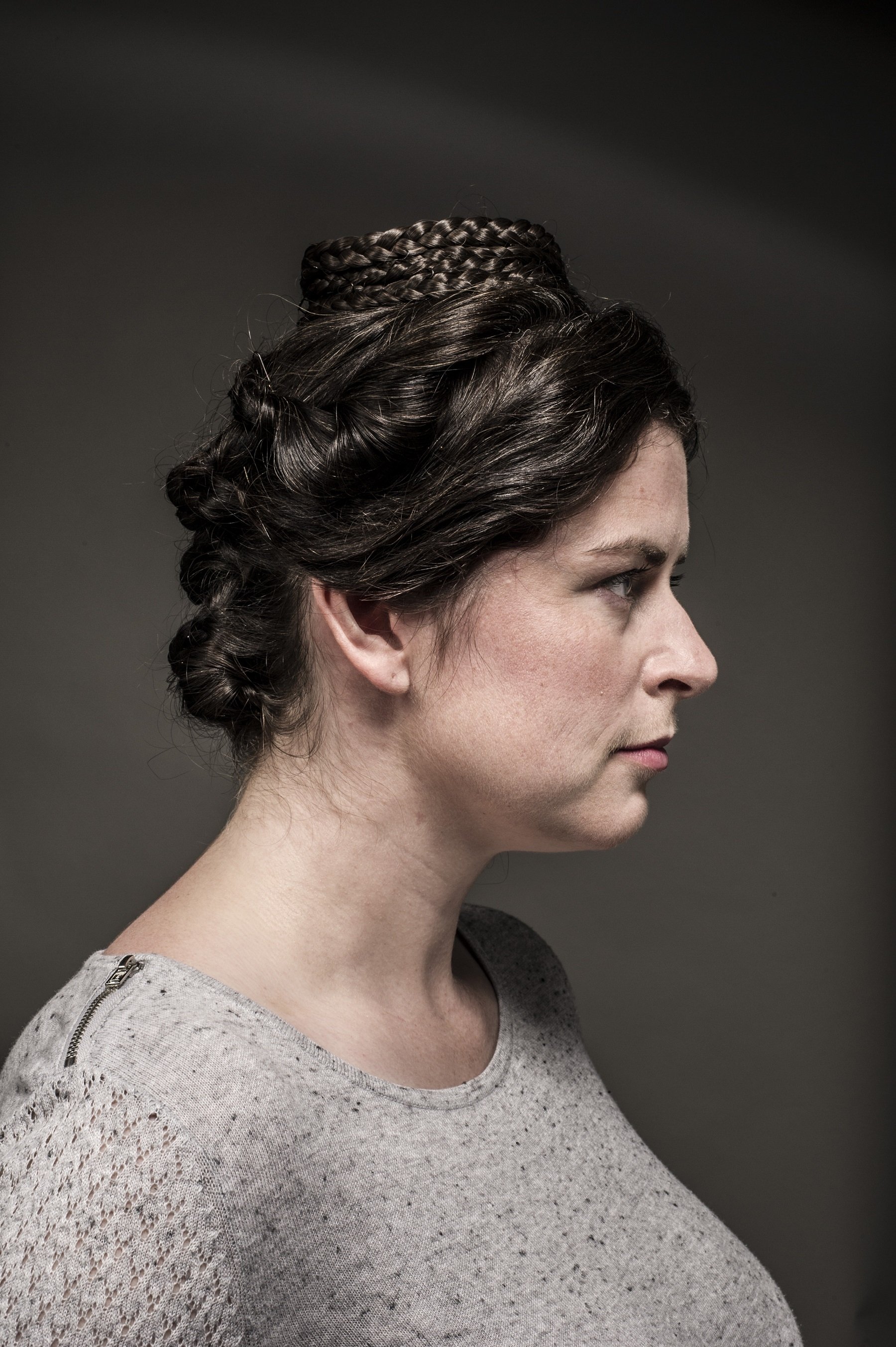 Profile of woman with plaited hairstyle
