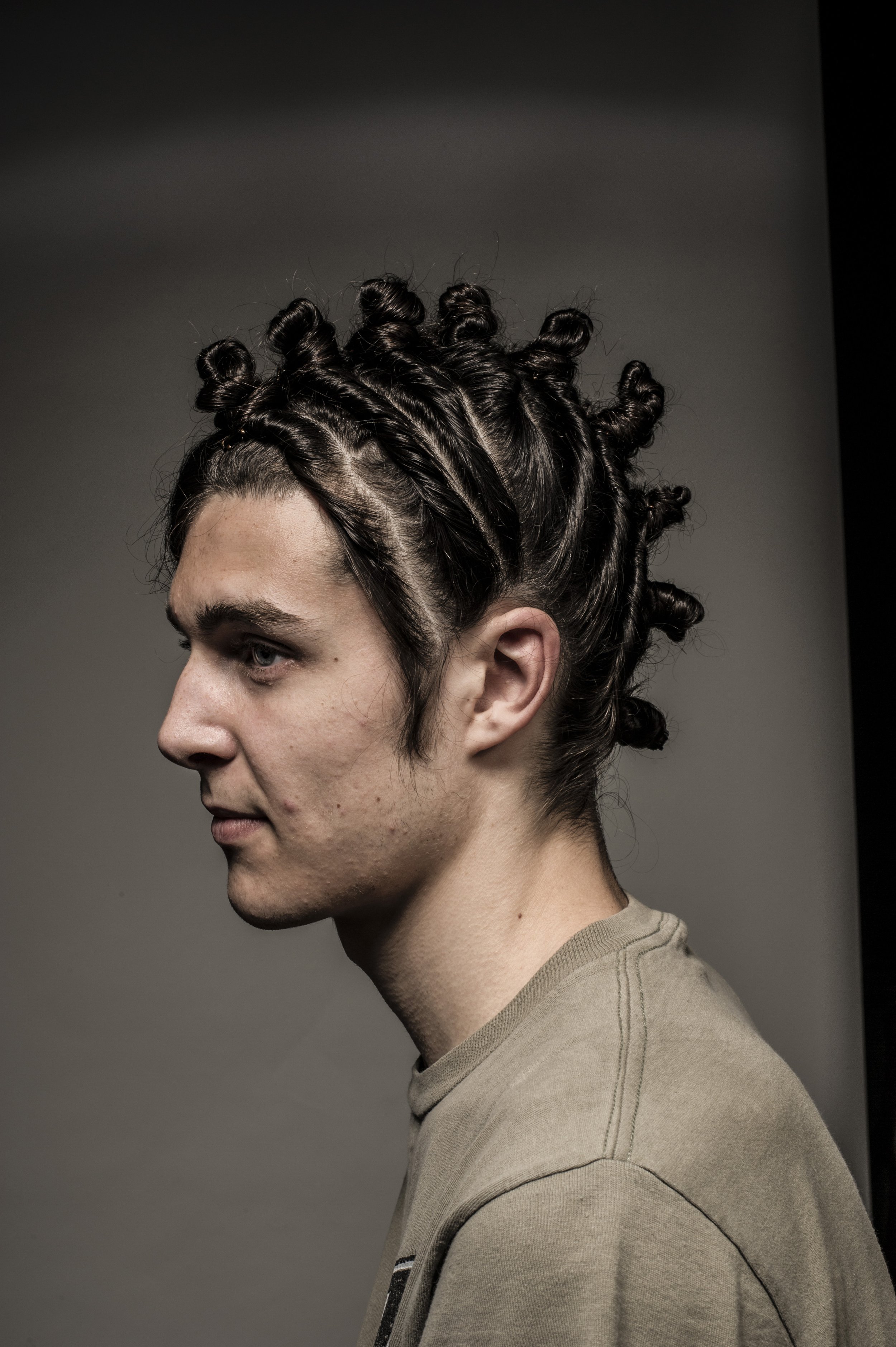 Profile of man with dark braided hair