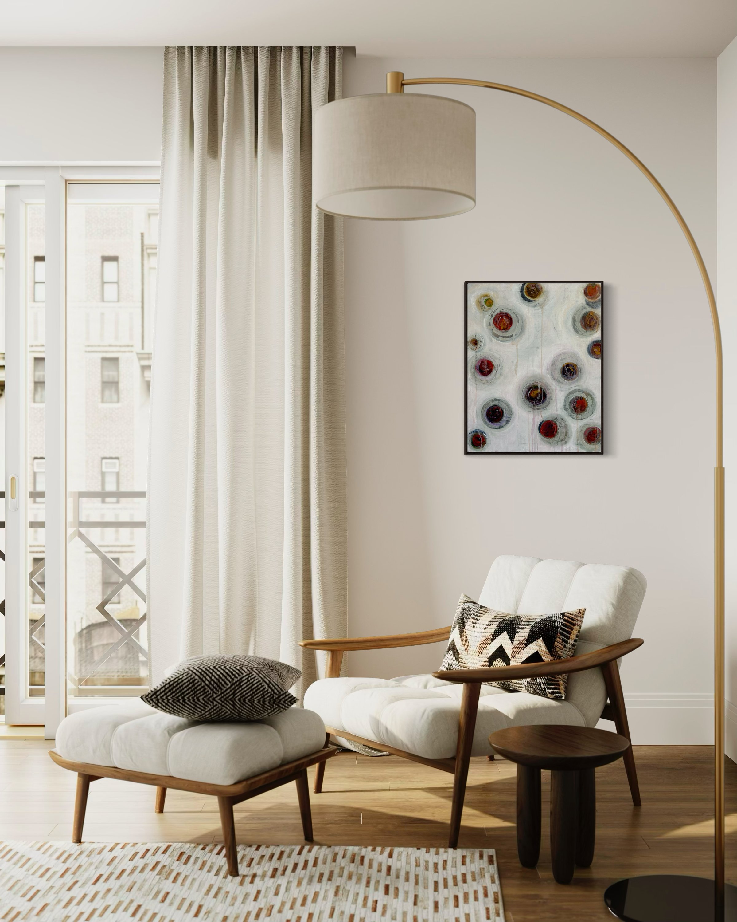 A canvas print of "A Latte Circles", by Tanja Blackley hangs in a casual living space above a chair.