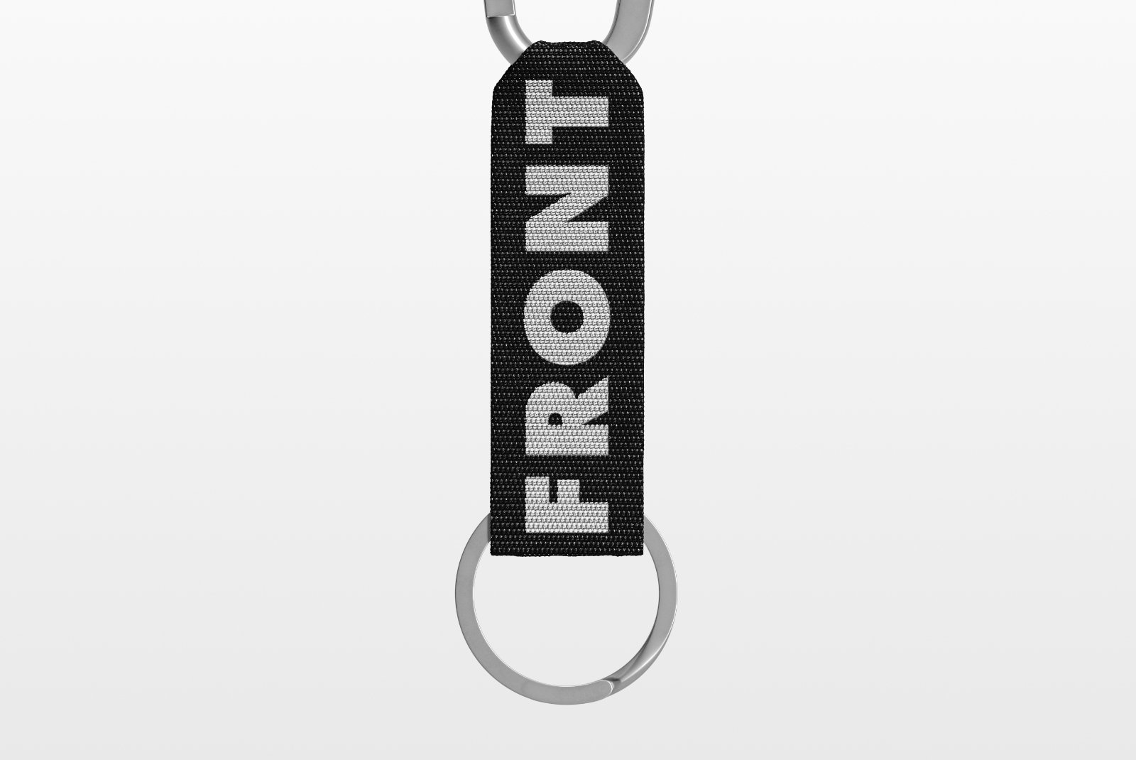 Close-up of black strap keychain with FRONT logo – FRONT Mockups