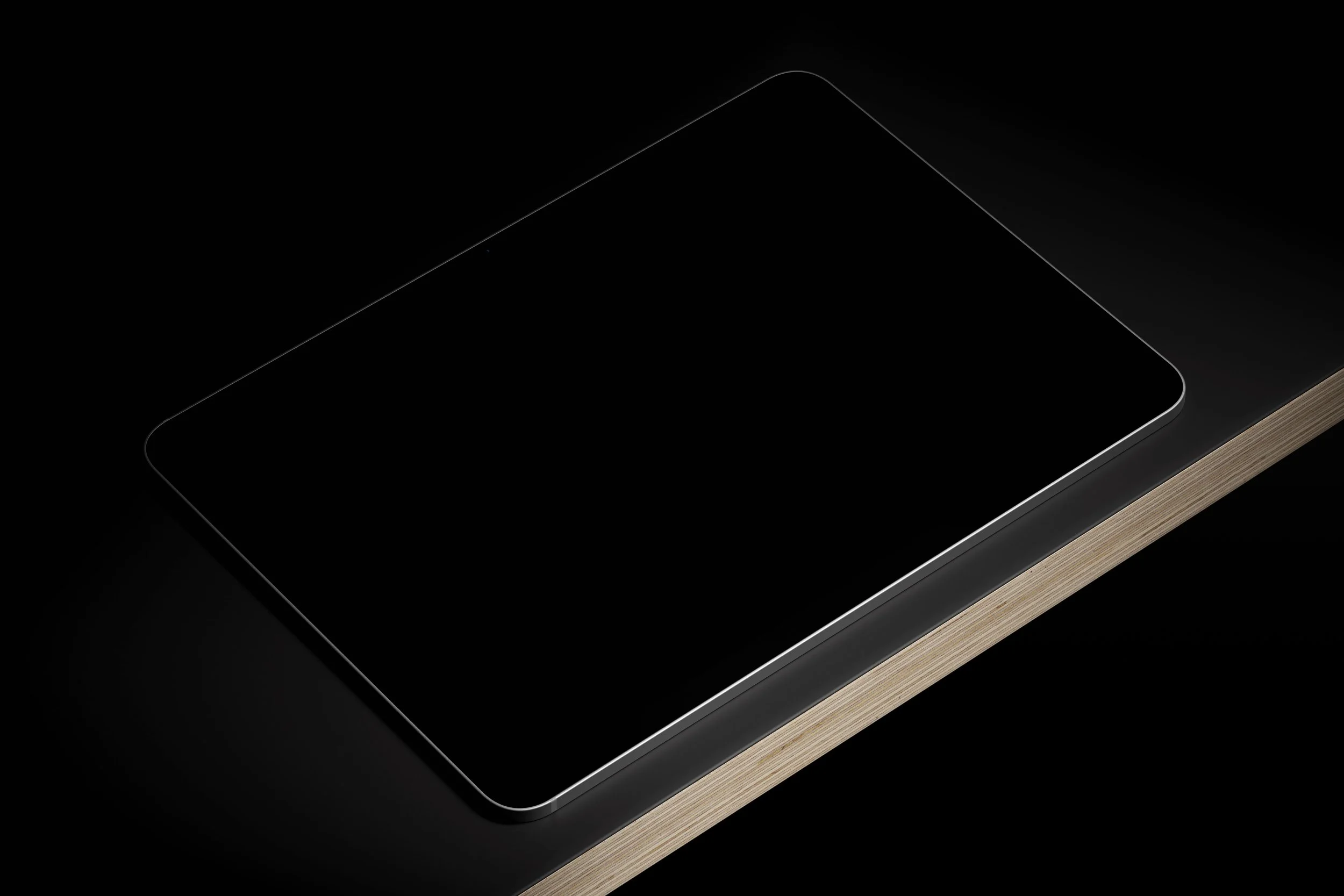 Minimal iPad Pro 11 PSD mockup with a blank black screen resting on a plywood base