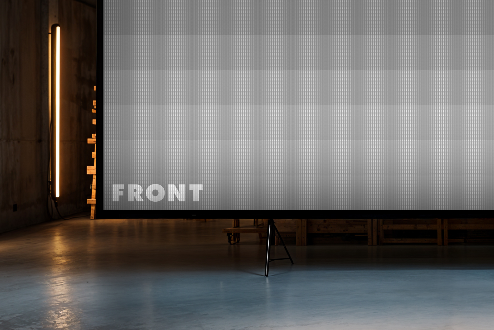 Dim warehouse screen mockup with side lighting – FRONT Mockups