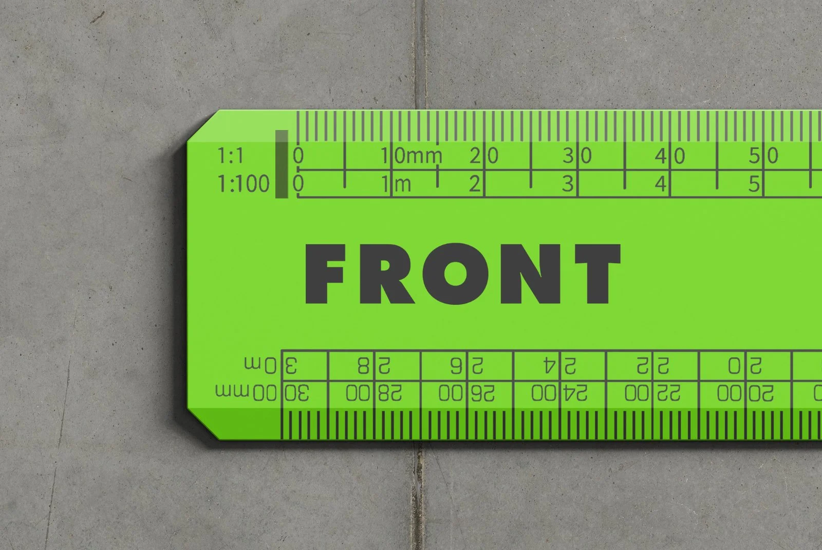 FRONT green techno ruler close-up on concrete, showing scale lines, corner angle and branding area