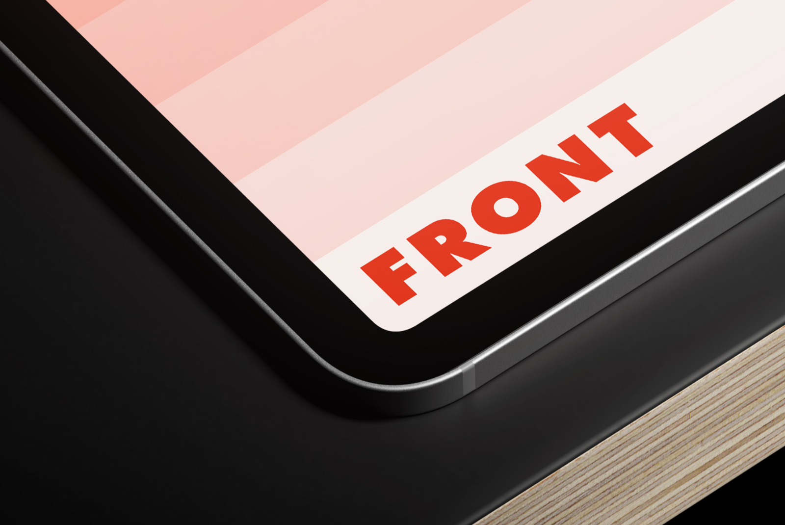 Detailed close-up of an iPad Pro 11 corner highlighting the aluminum frame and plywood base