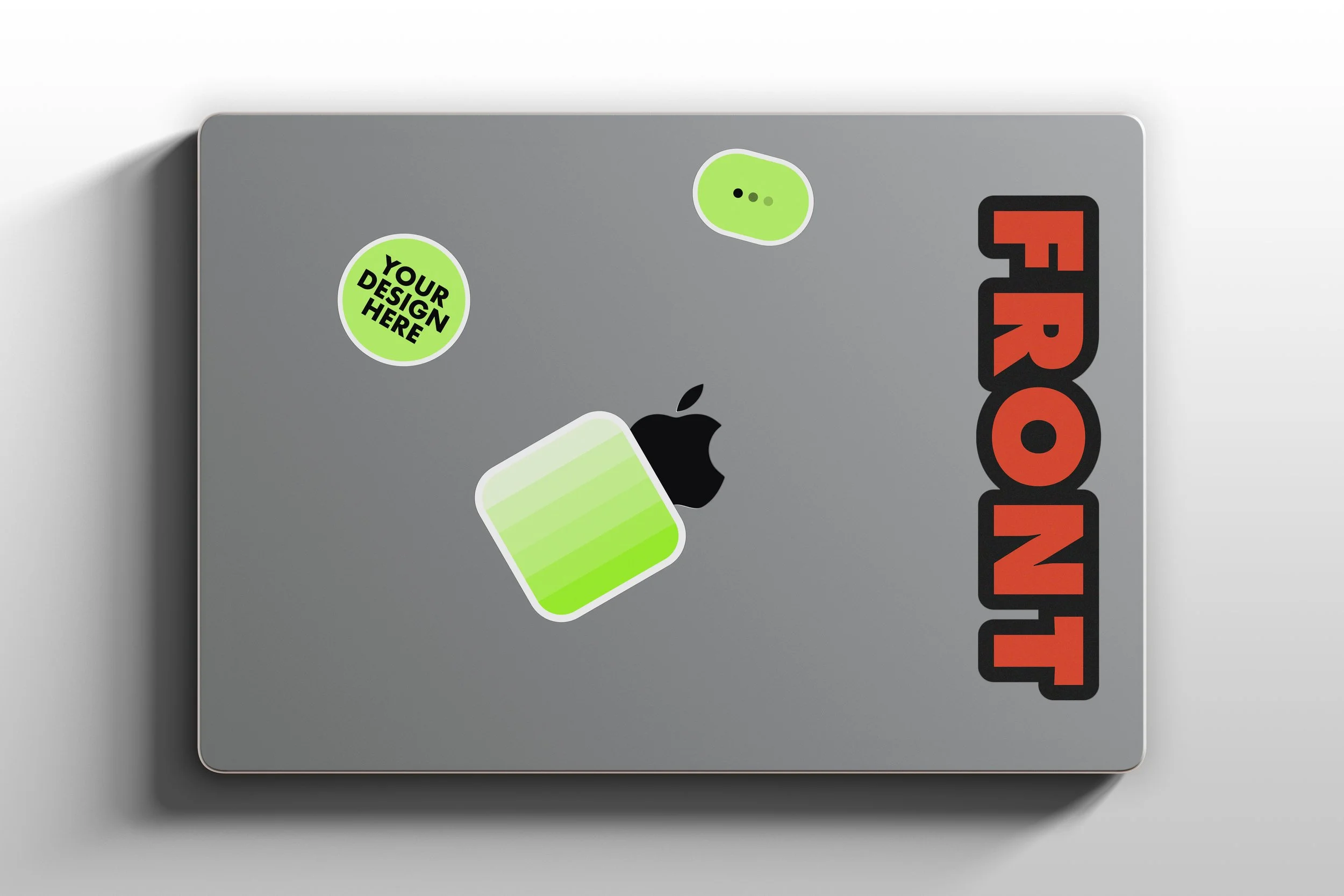 MacBook Pro sticker mockup with multiple decals on lid, top view