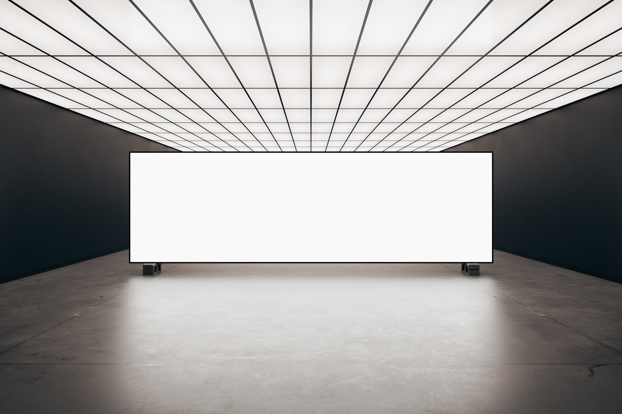 Blank large screen display in illuminated room with concrete floor – FRONT Mockups