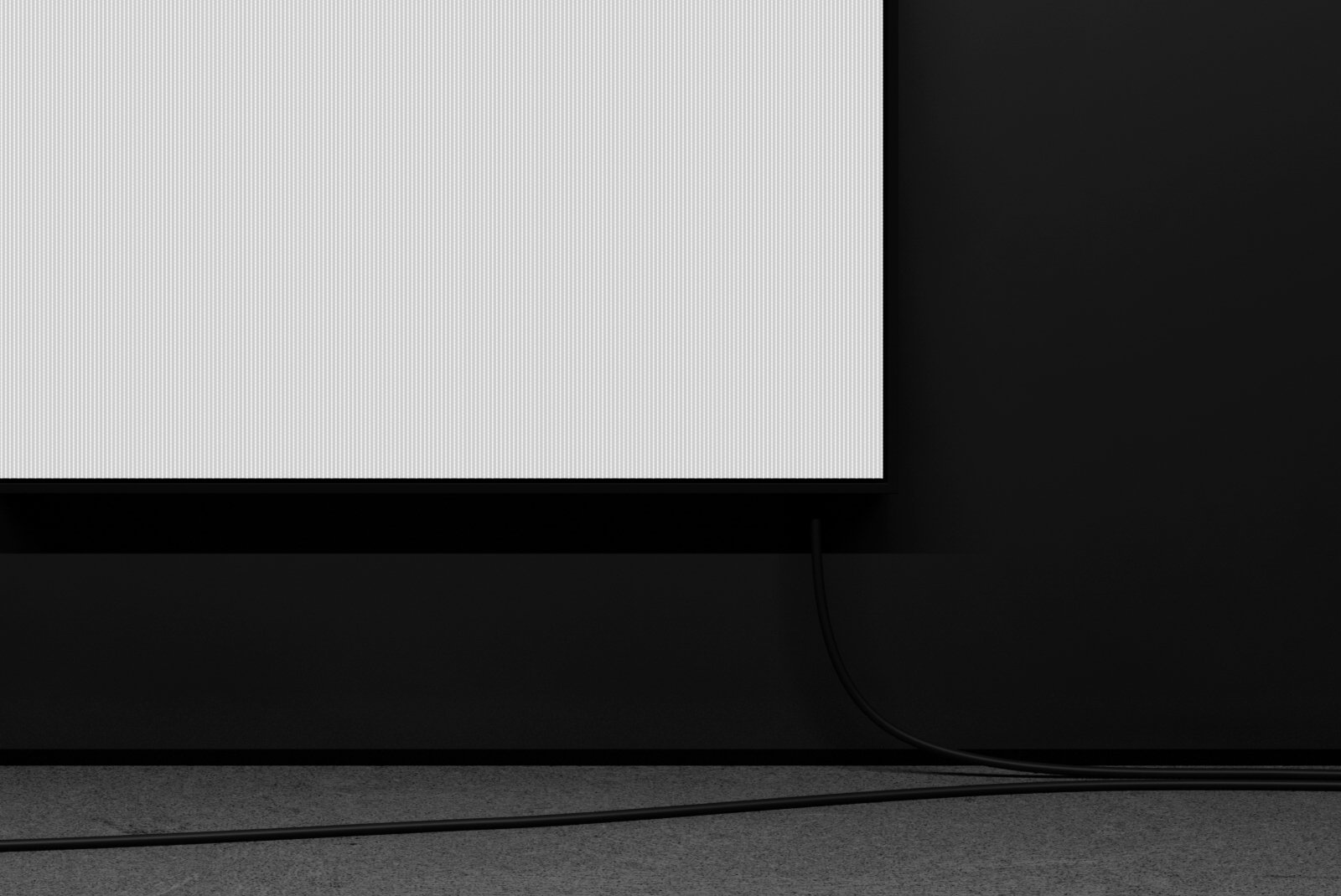Lower detail of white screen edge and cable on concrete floor – FRONT Mockups