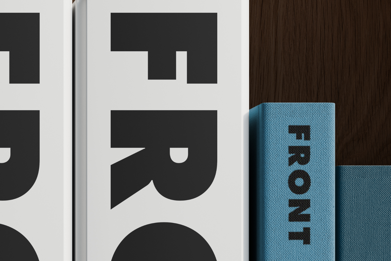 Close-up of branded folders and book spines on a shelf