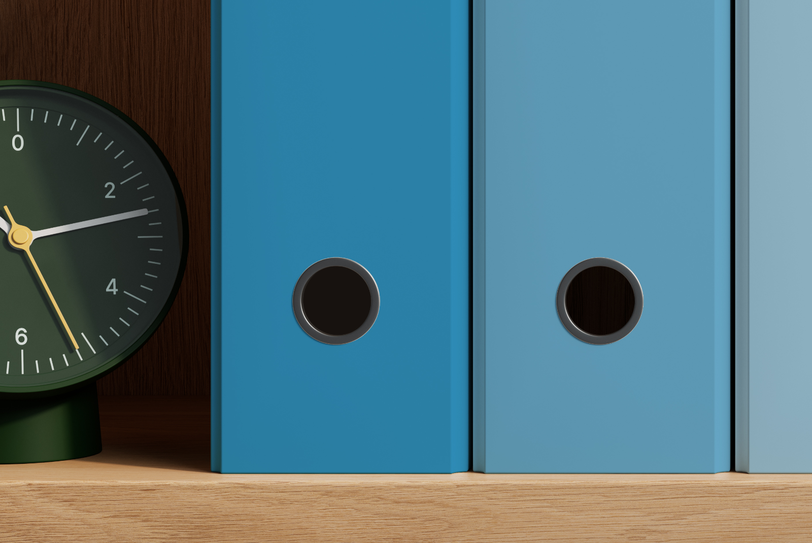 Close-up of customizable folder colors and ring pulls on a wooden shelf