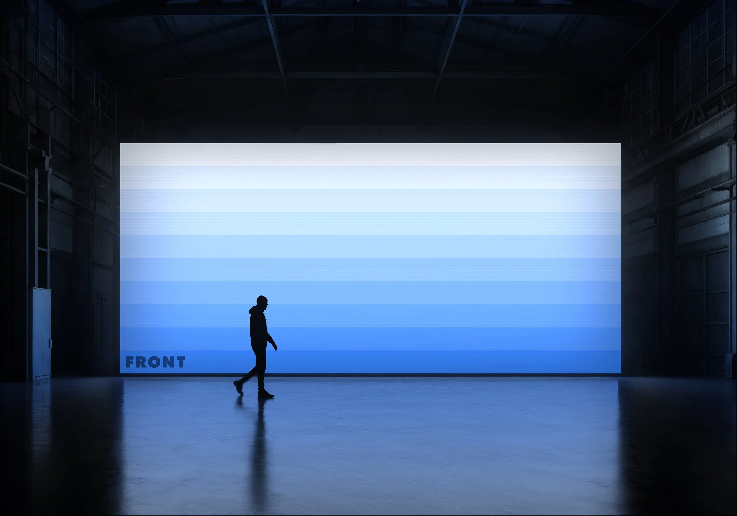 FRONT silhouette screen mockup with a large illuminated blue display in a dark industrial hall.