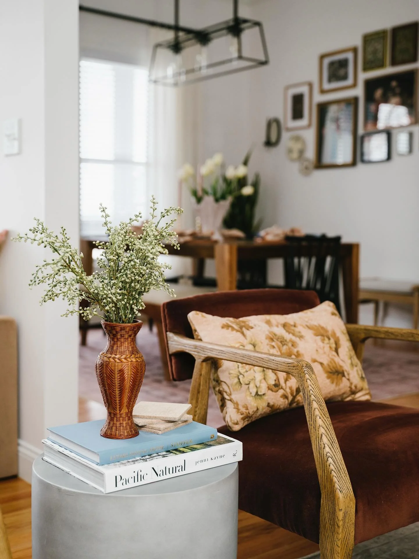 Another antique find&mdash;this woven vase adds the perfect layer of texture and warmth. Just a few simple stems and a stack of favorites to complete the moment. ✨ #collectedhome #vintagetouches #interiorstyling

Photography: @oliviagird 
Styling: @n