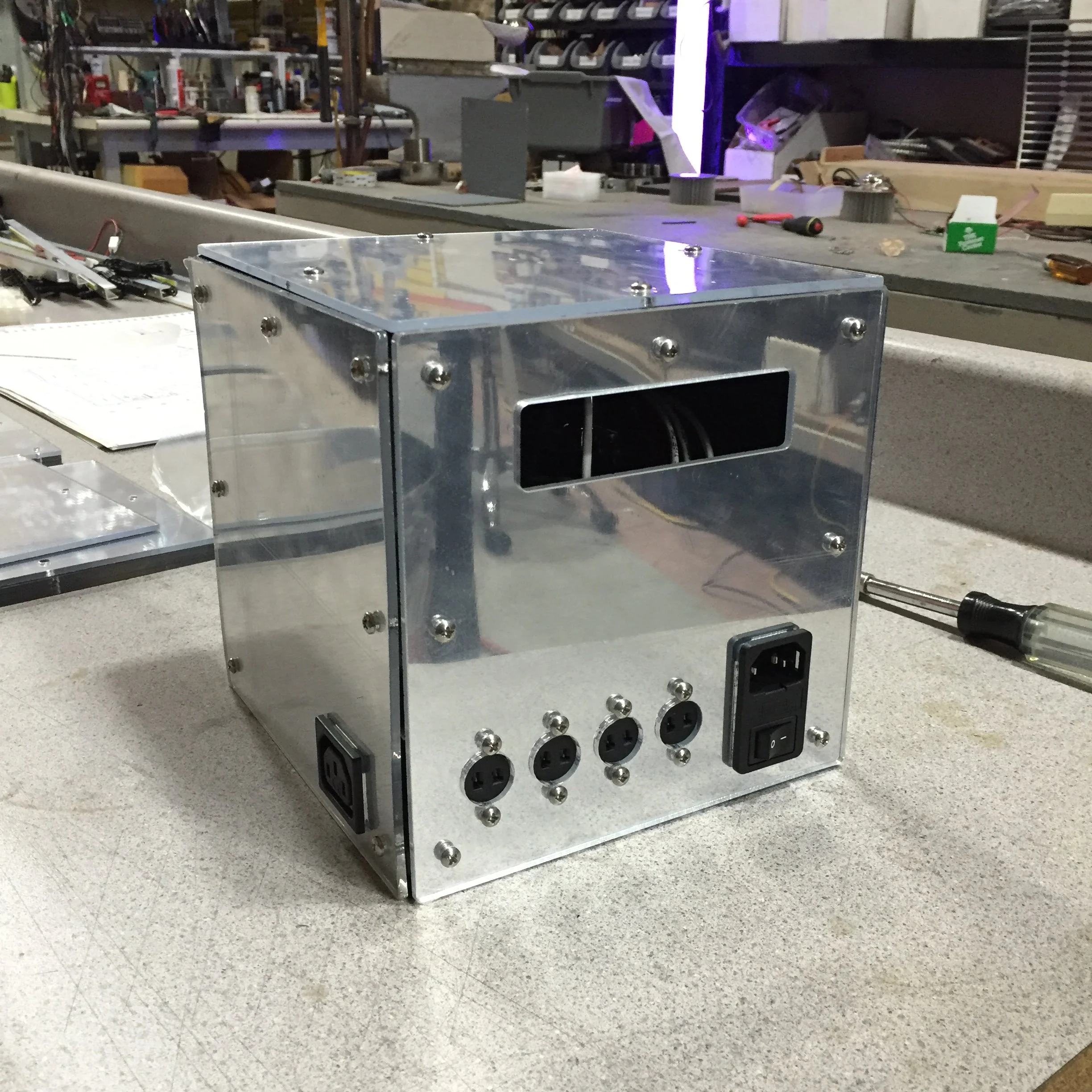 Laser cut mirrored enclosure with internal battery and integrated charger to power linear LED lighting