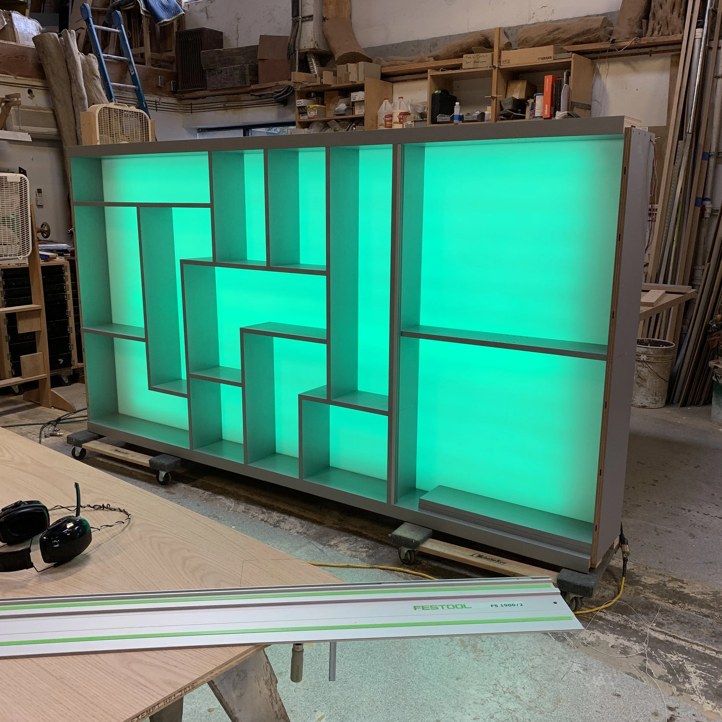 Wirelessly controlled RGBW backlighting for a custom bookcase