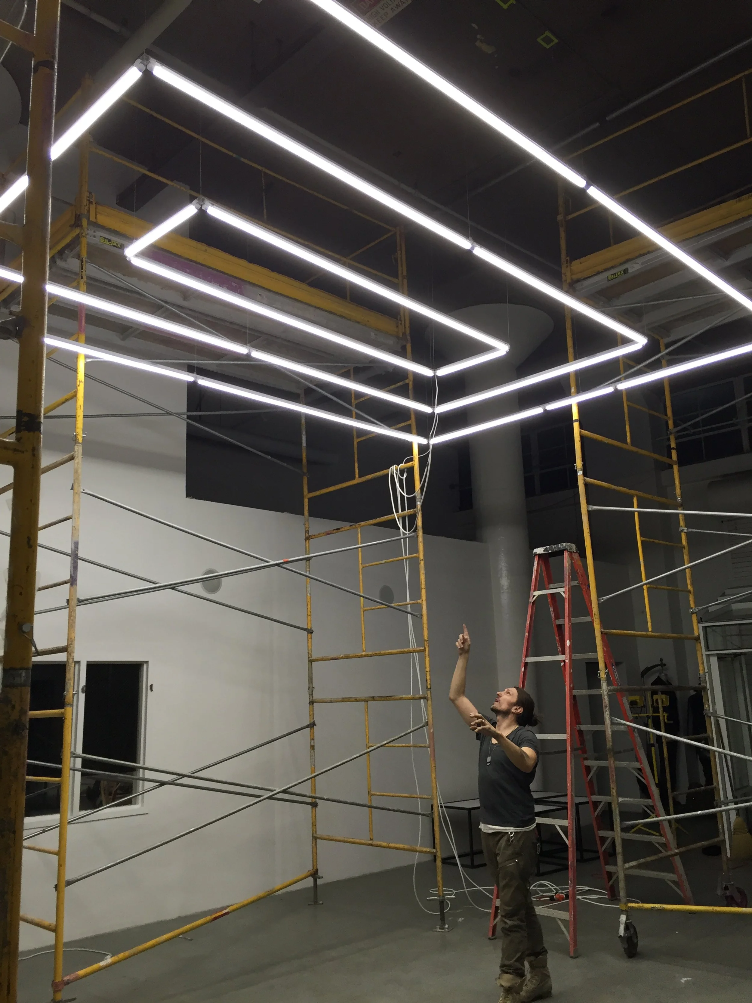 Tubular and adjustable LED chandelier designed for N.I.C.E. Collective showroom, San Francisco, California