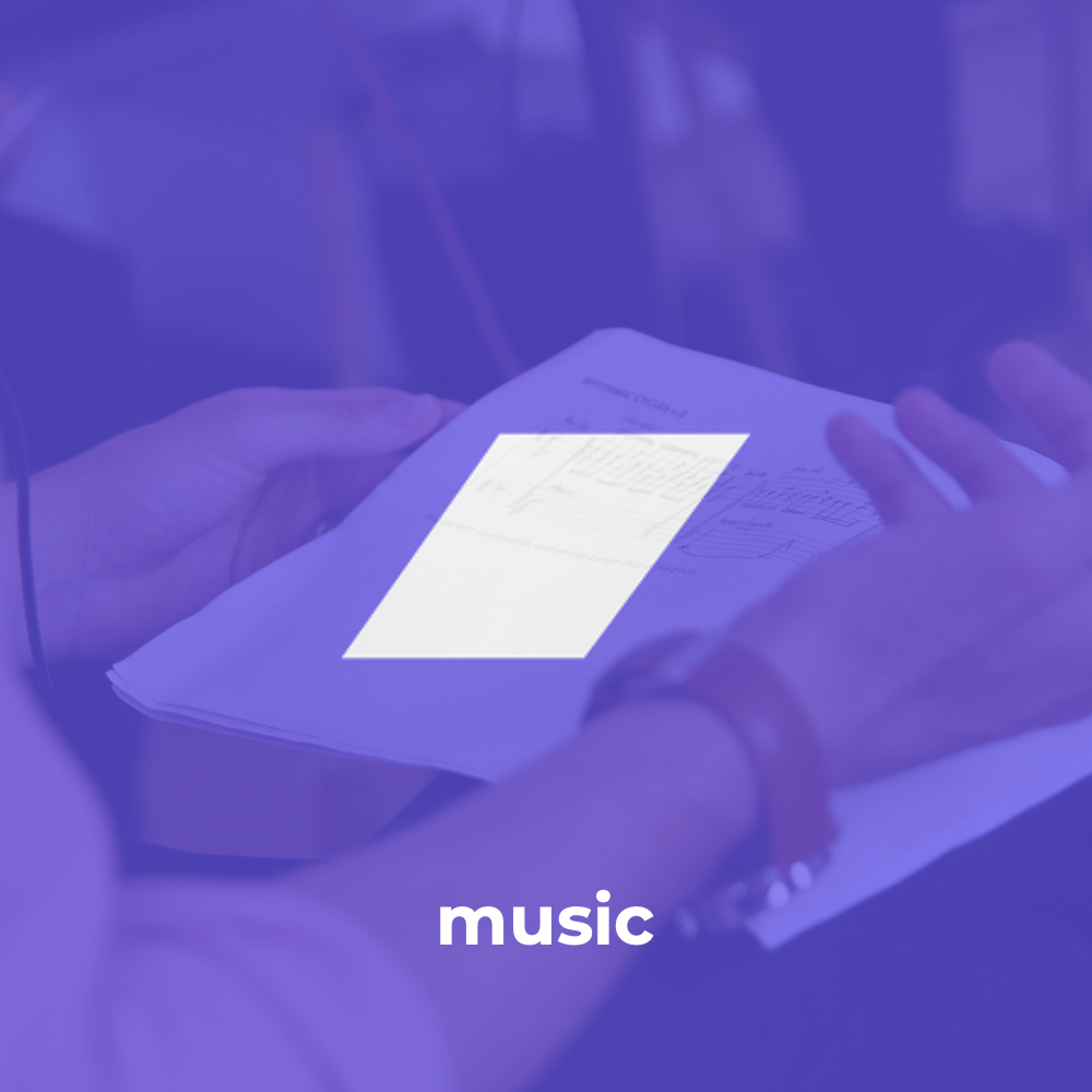 Hands holding musical notation