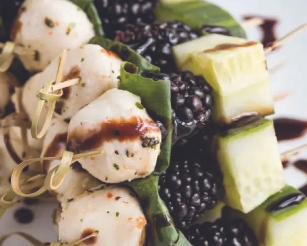 marinated mozzarella balls with blackberry and cucumber