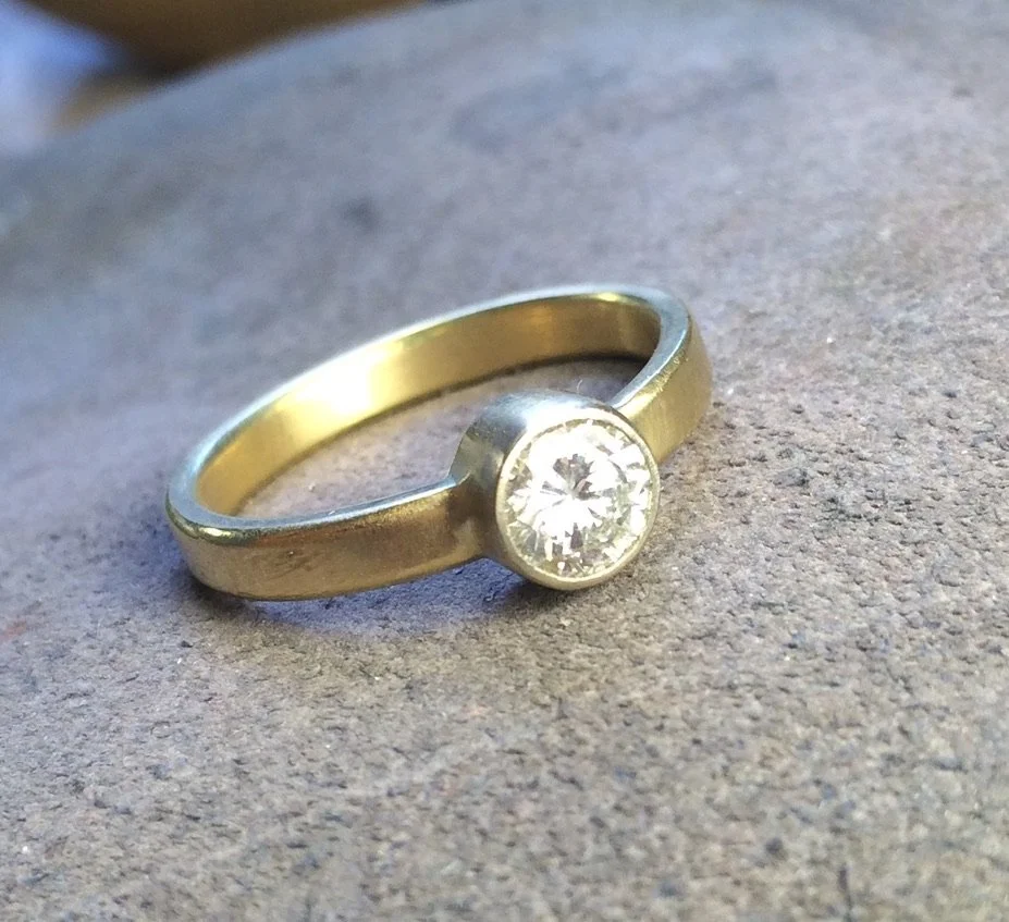 Diamond in 14k yellow and white gold