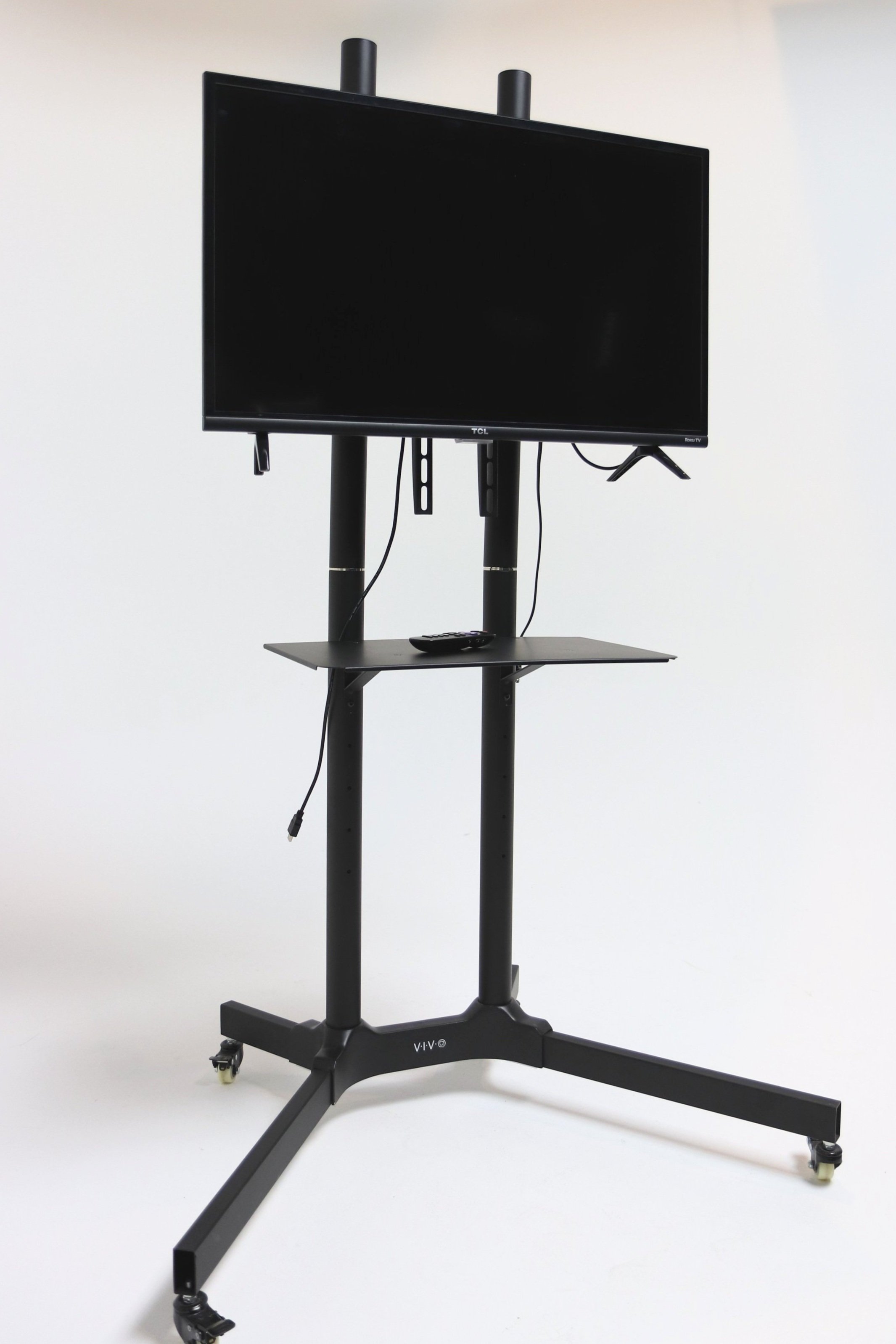T.V. on rolling stand equipped with Roku.
