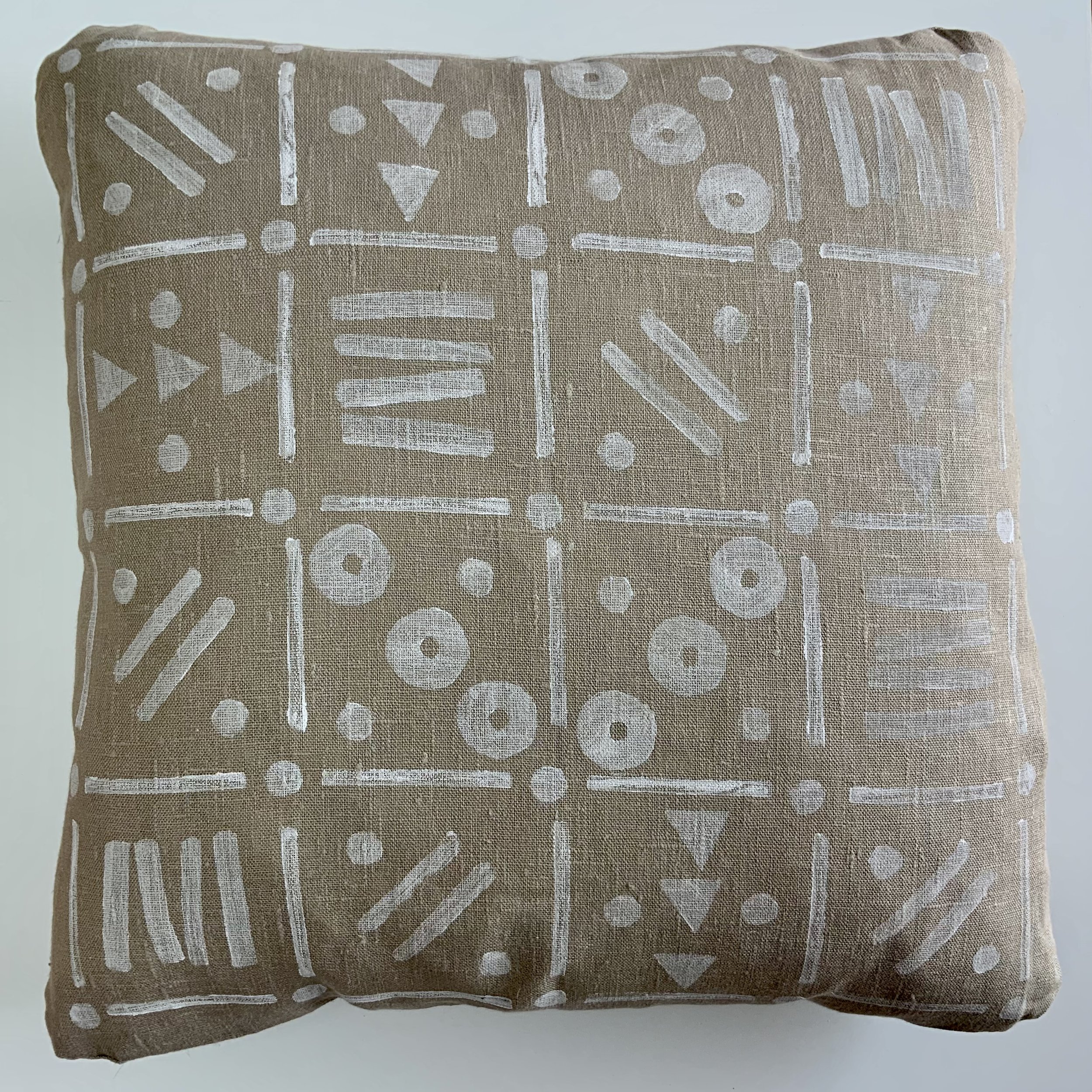 Hand-printed cushion by Susie Honnor using potatoes in Devon on 100% natural linen. 'White Grid' uses white ink with varying patterns in eachsquare of the grid. Back of cushion.