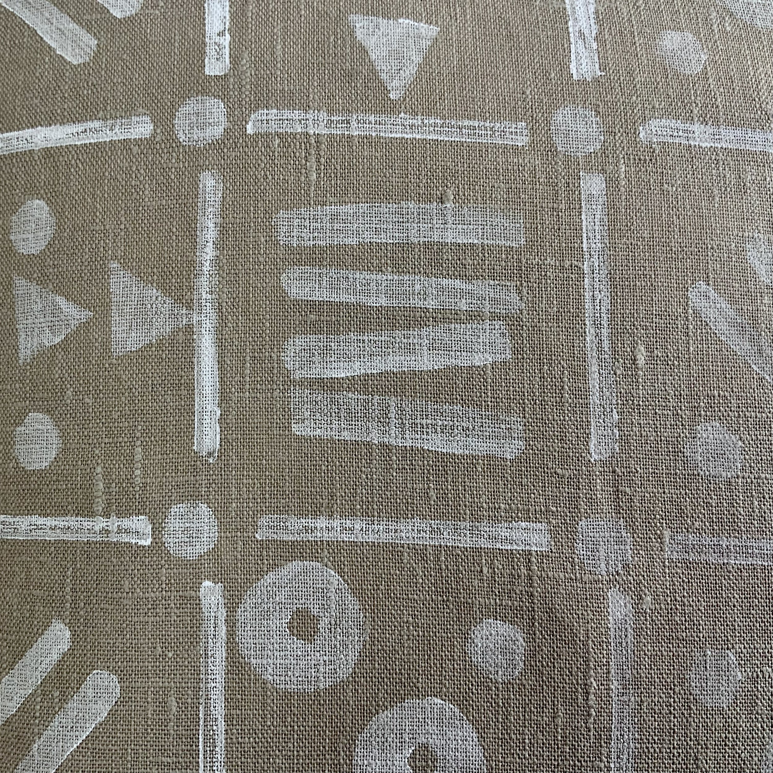 Hand-printed cushion by Susie Honnor using potatoes in Devon on 100% natural linen. 'White Grid' uses white ink with varying patterns in eachsquare of the grid.. Detail.