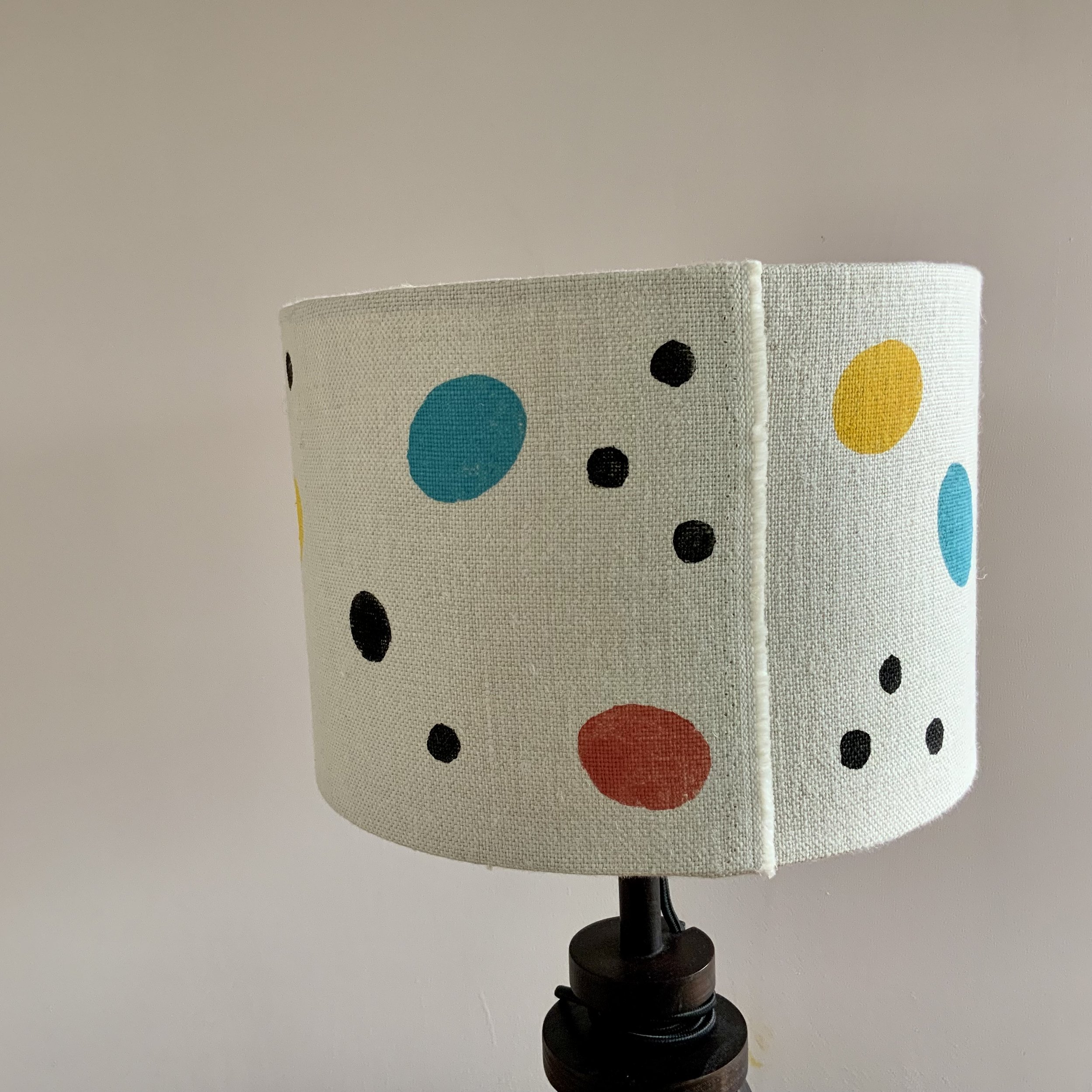 This lampshade has been hand printed in Devon, with potatoes and sustainable fabric inks. 40cm x 21cm.