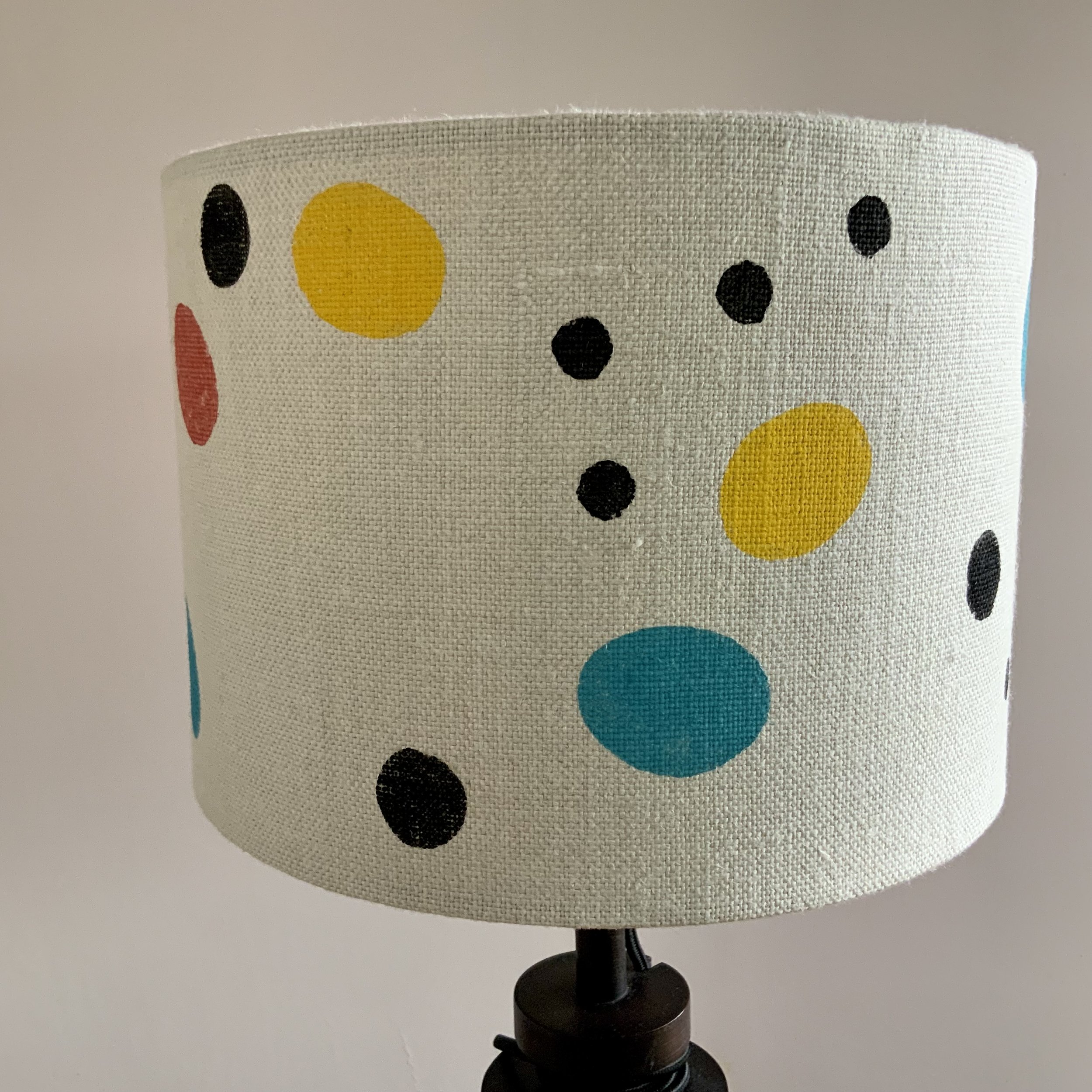 This lampshade has been hand printed in Devon, with potatoes and sustainable fabric inks. 40cm x 21cm.
