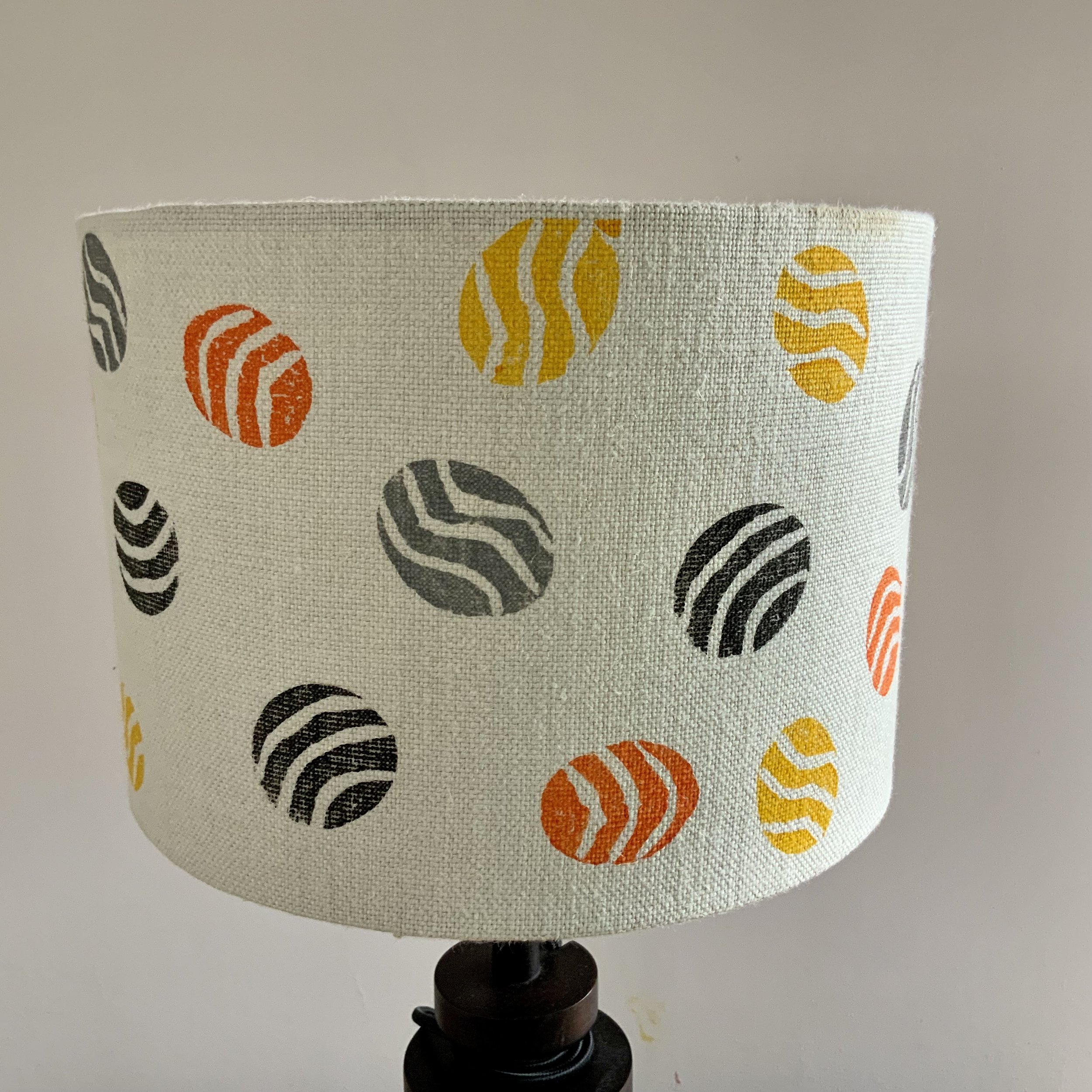 This lampshade has been hand printed in Devon, with potatoes and sustainable fabric inks. 40cm x 21cm.