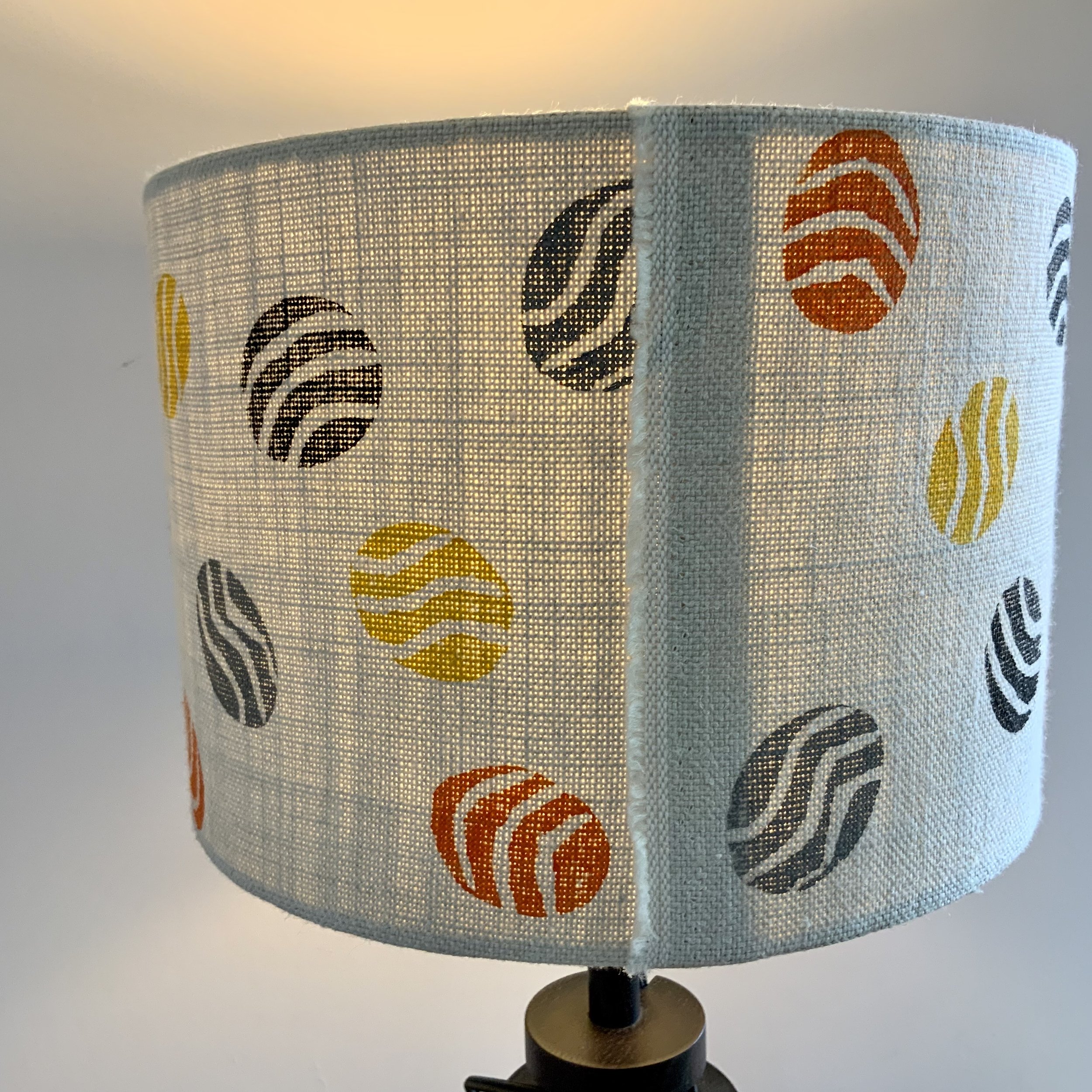 This lampshade has been hand printed in Devon, with potatoes and sustainable fabric inks. 40cm x 21cm.
