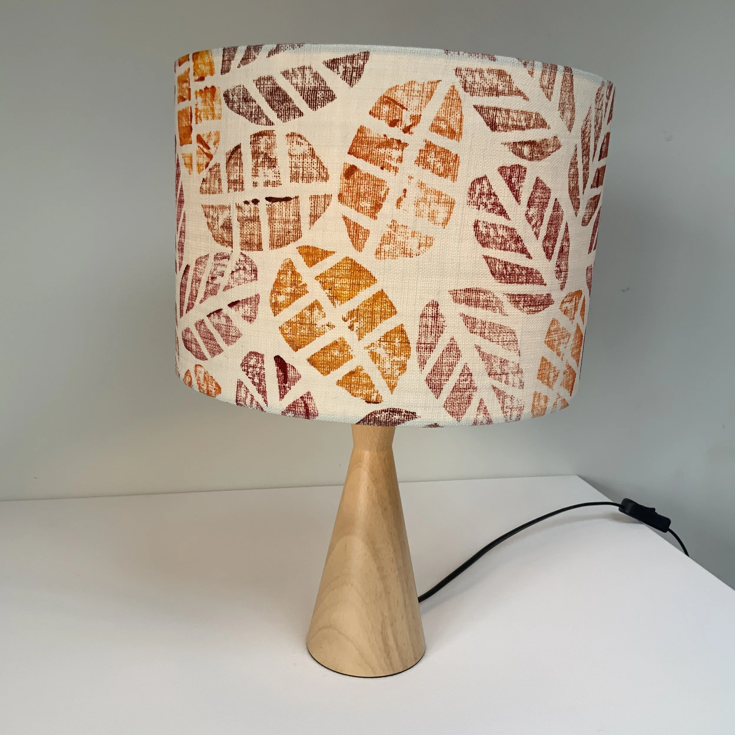 Hand printed lampshade in warm  colours inspired by autumn leaves.