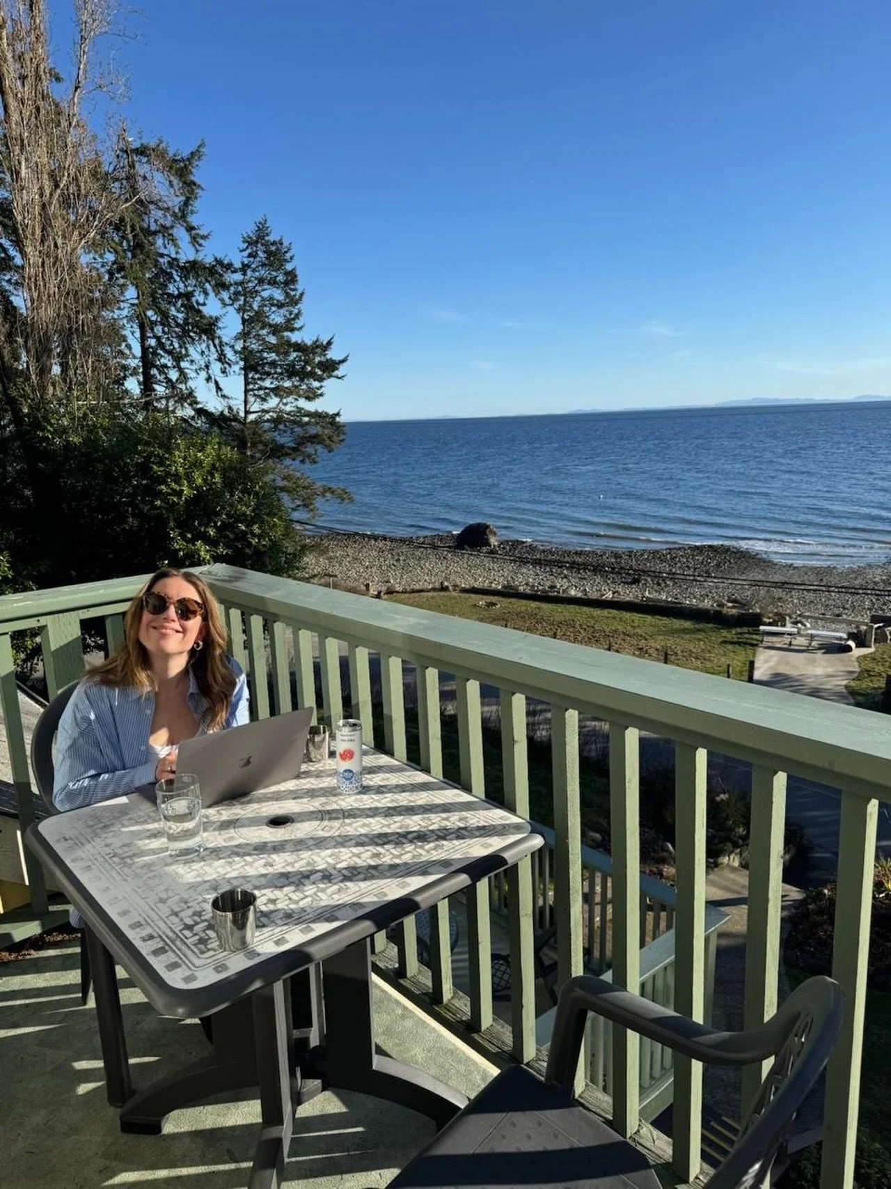 This is a photo of Jenna working on a patio by the beach. Jenna loves her job. And patios. And the beach. 

But Jenna won&rsquo;t be by the beach today! Instead she&rsquo;ll be pouring you delicious things from behind the bar at TIWS&rsquo; Wine Bar 