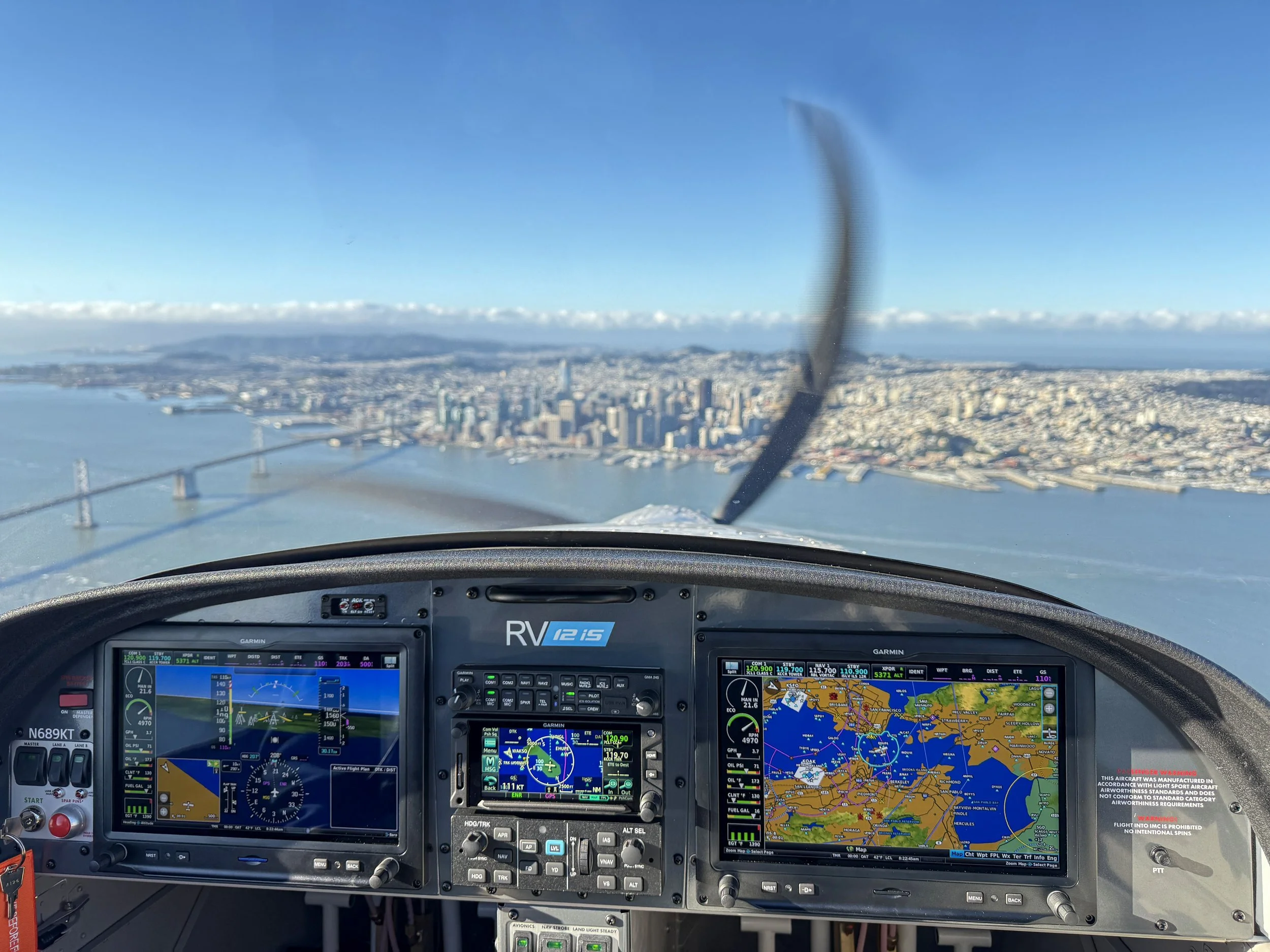 View from TrexAir Aviation Academy Van's RV-12is cockpit flying over San Francisco Bay Area – Garmin G3X glass panel dual displays showing real-time flight data during student pilot training flight from Buchanan Field Concord California