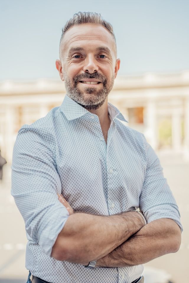 A man smiling with confidence