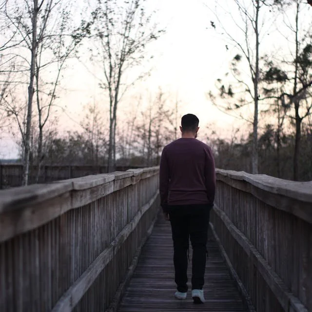 Man walking on a bridge