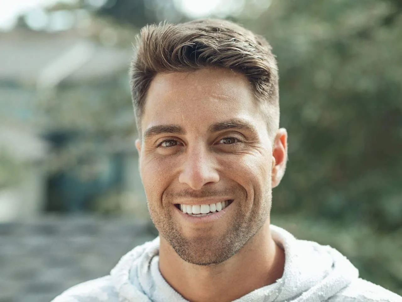 a man smiling outside