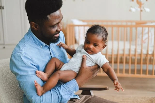 Man with his newborn