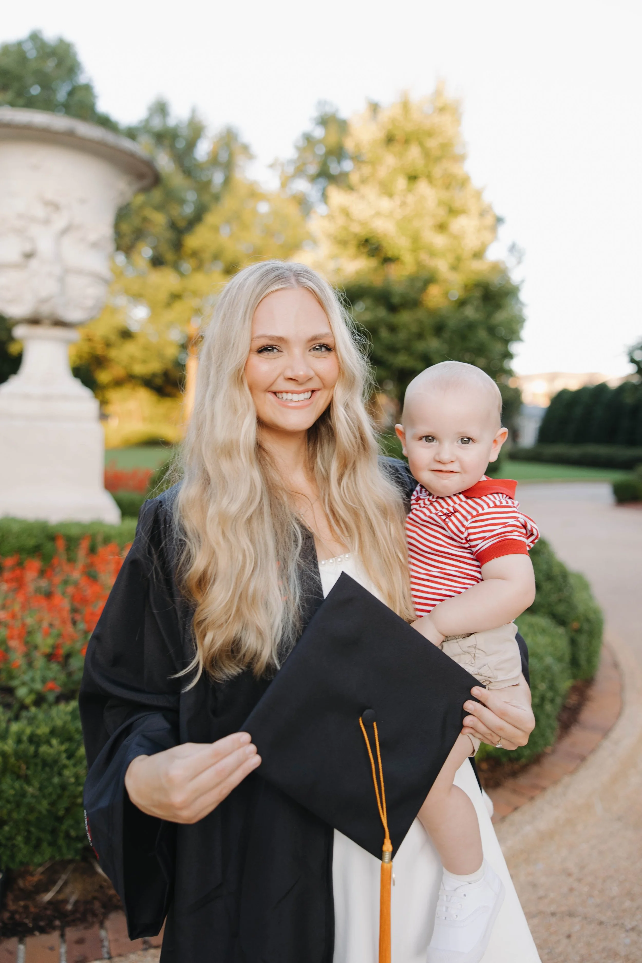 Student-Mom, Morgan, with her baby at graduation