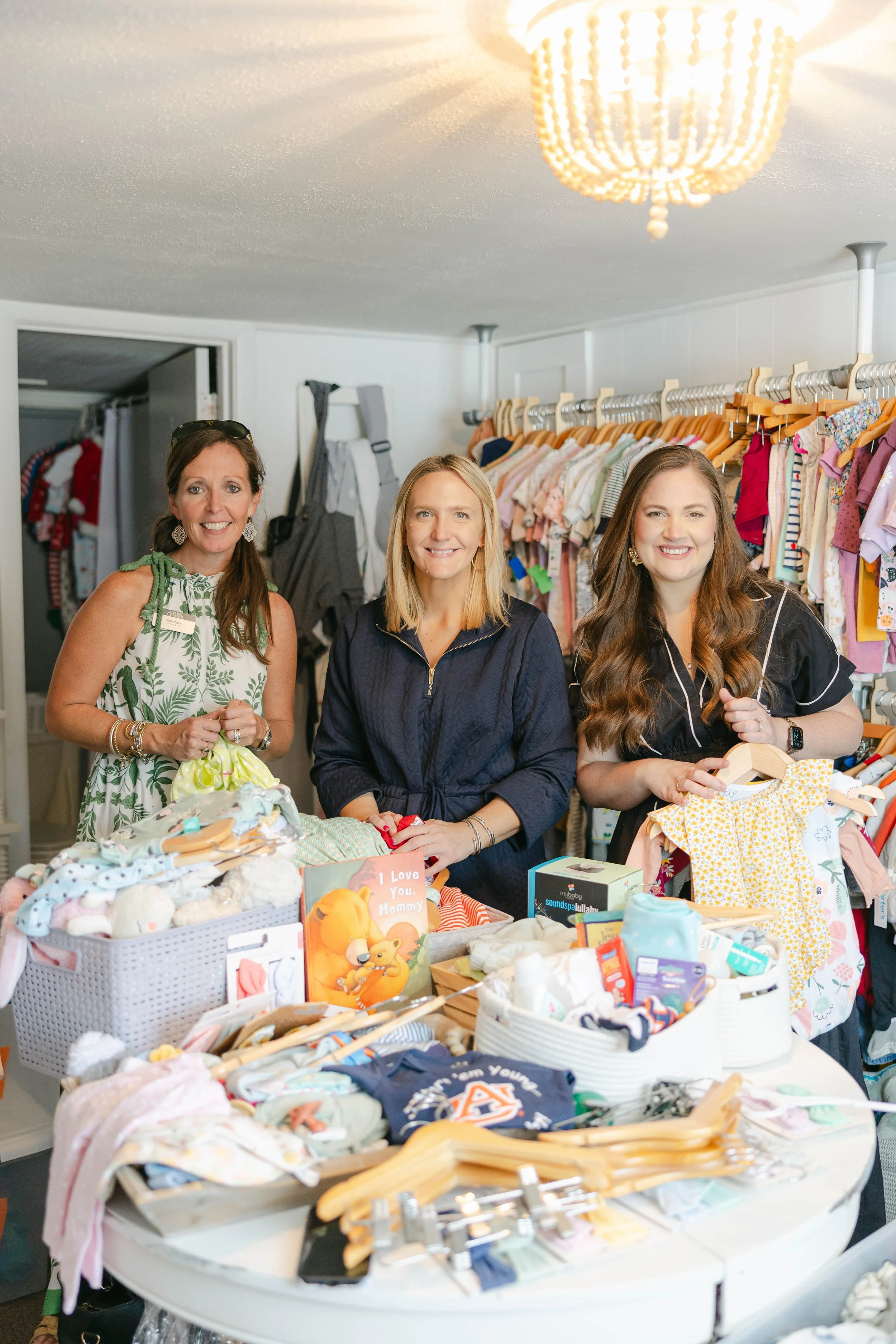 volunteers providing baby clothes for the Baby Boutique