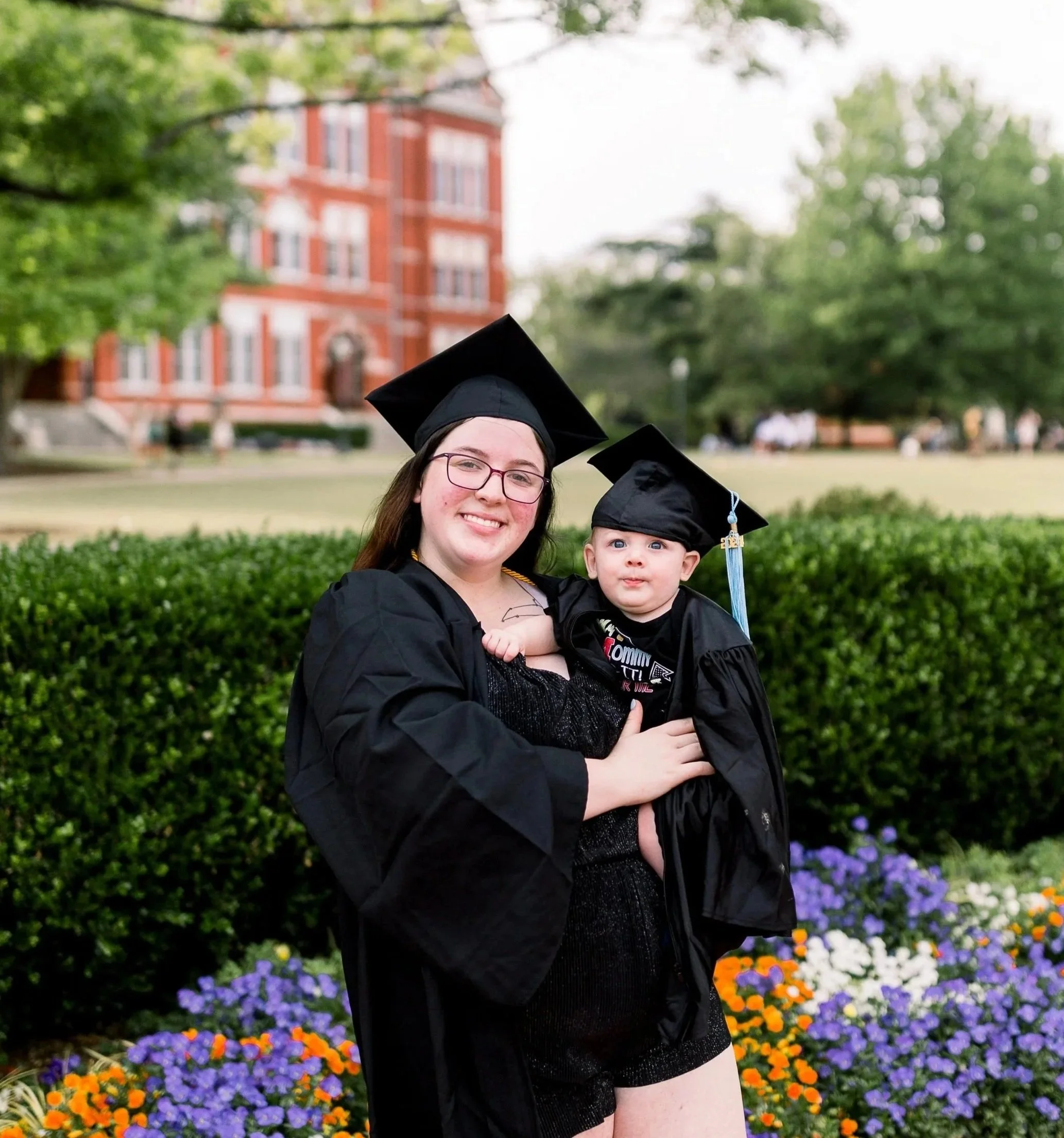 Alexis graduating with her baby by her side