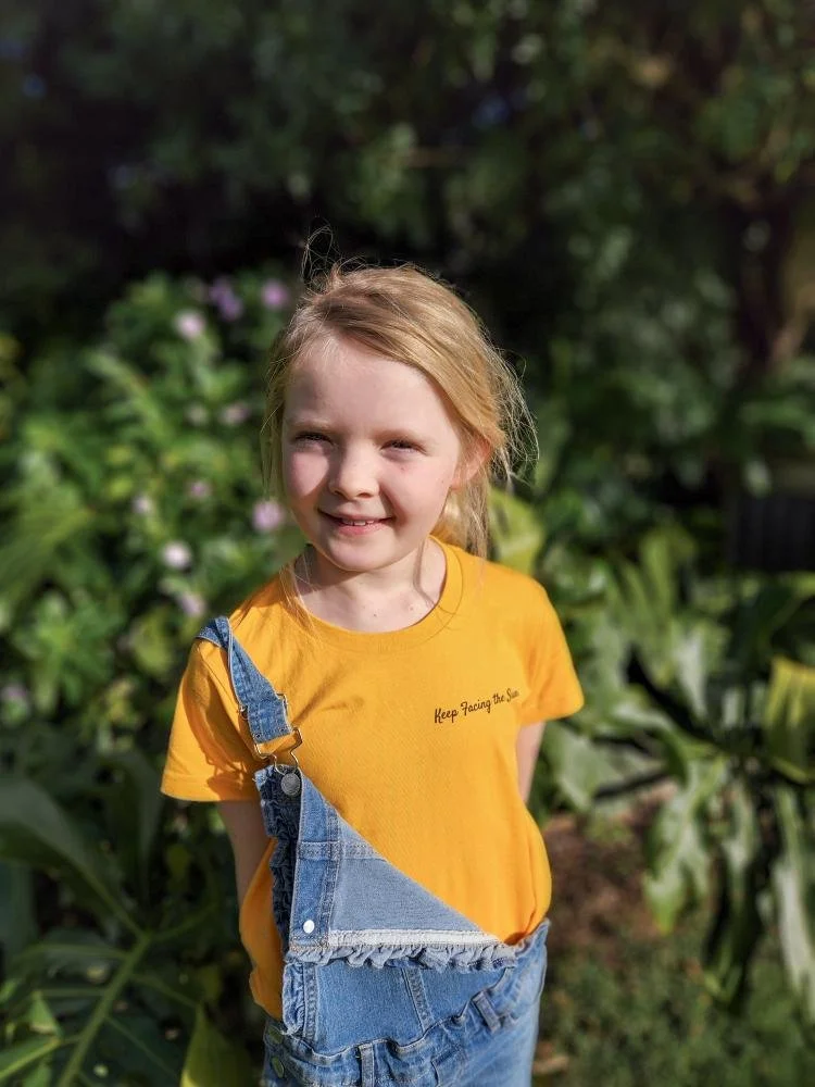 mangamaire_sunflower_field_girl_wearing_tshirts_yellow.jpeg