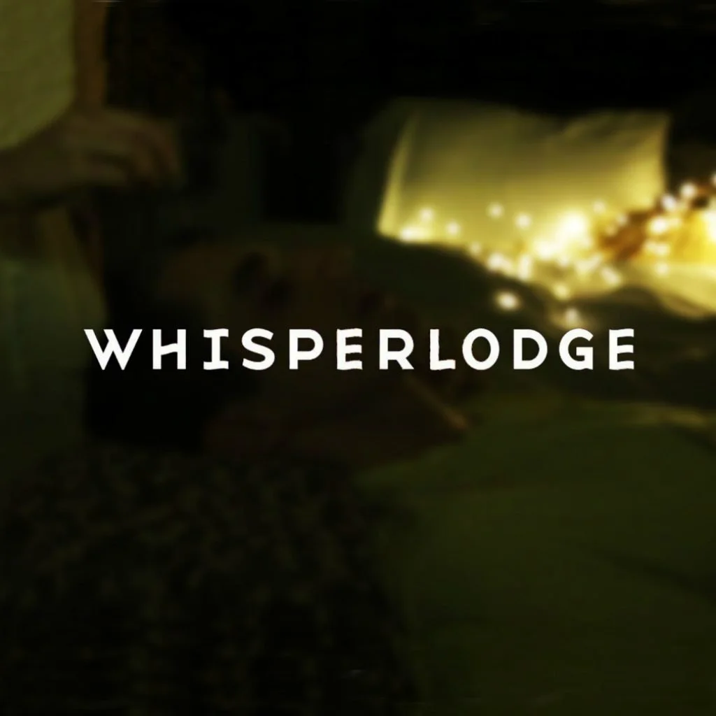 A person resting in bed with fairy lights, with the word 'Whisperlodge' overlaid in white text.