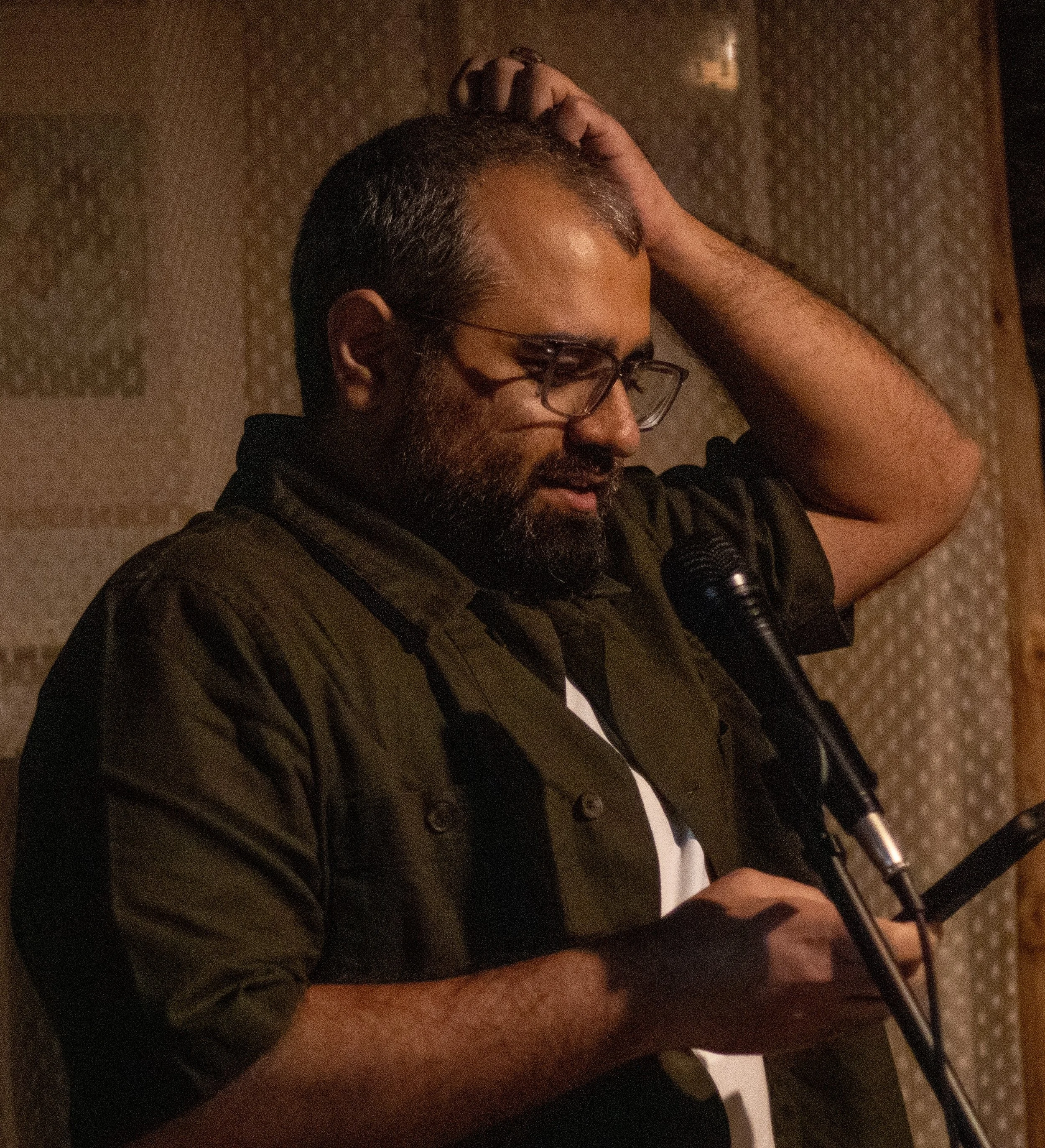 A photo of Lavanya Arora speaking into a microphone