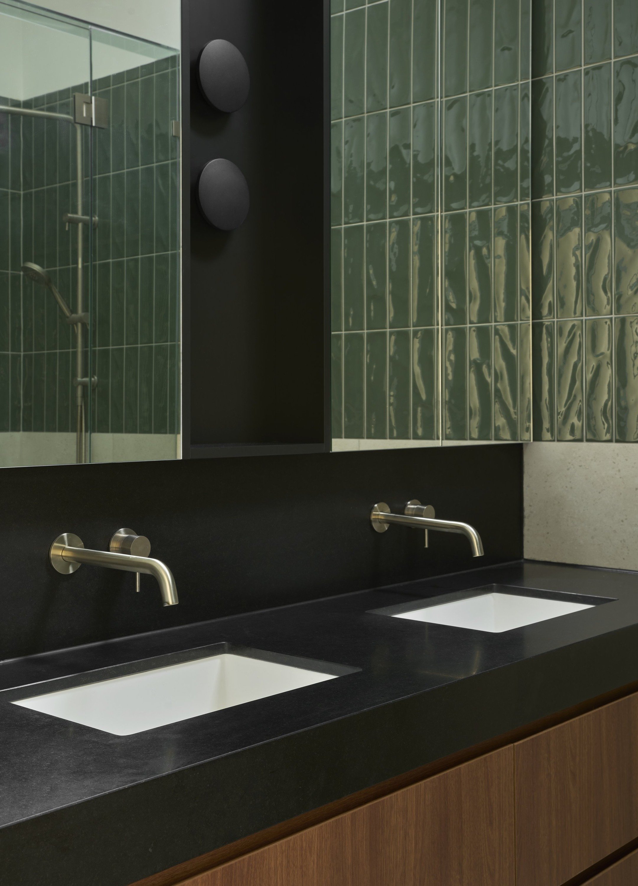 Carlton North House double vanity with black benchtop and green tiled shower