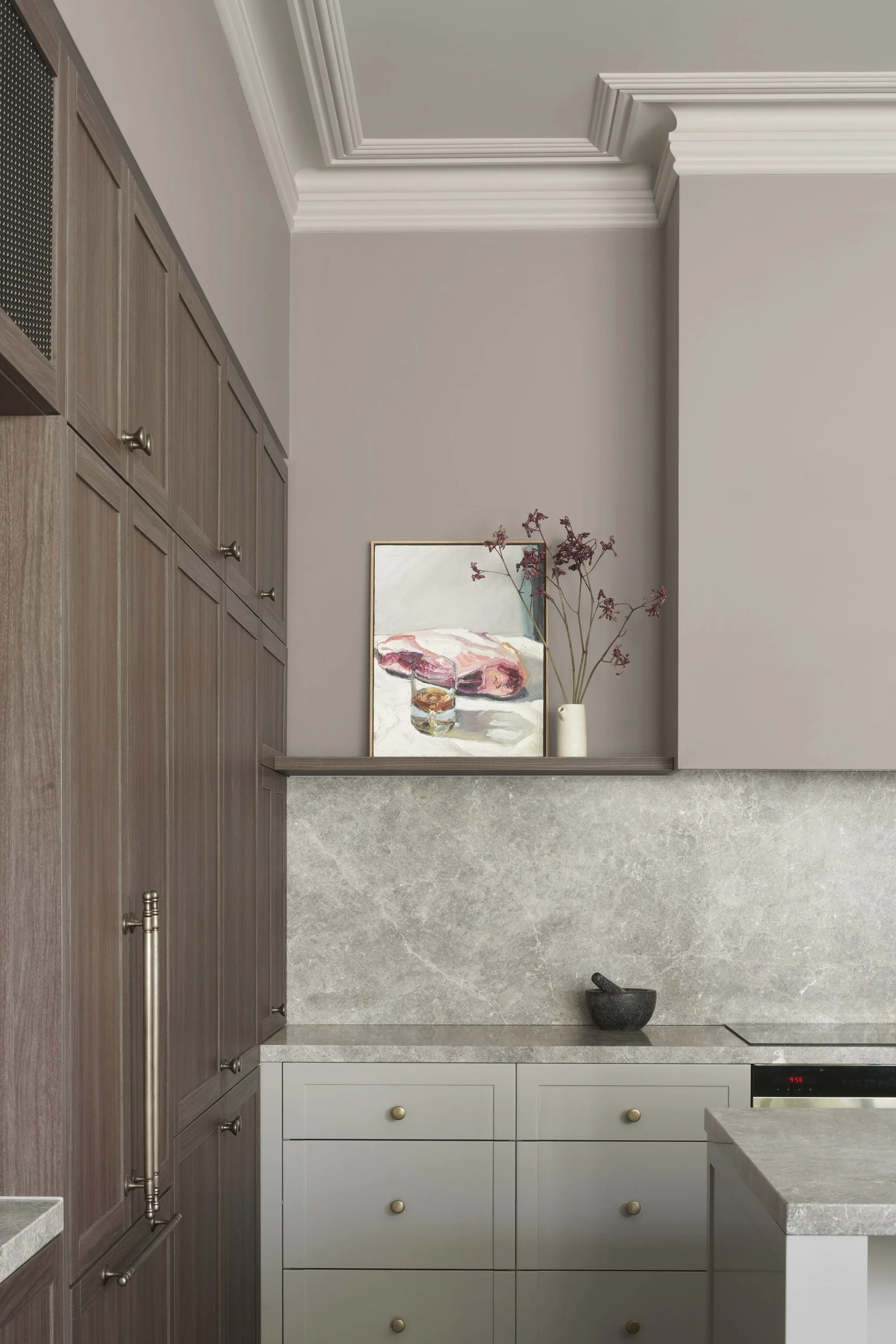 Richmond House kitchen corner with timber cabinetry, stone splashback and cornice