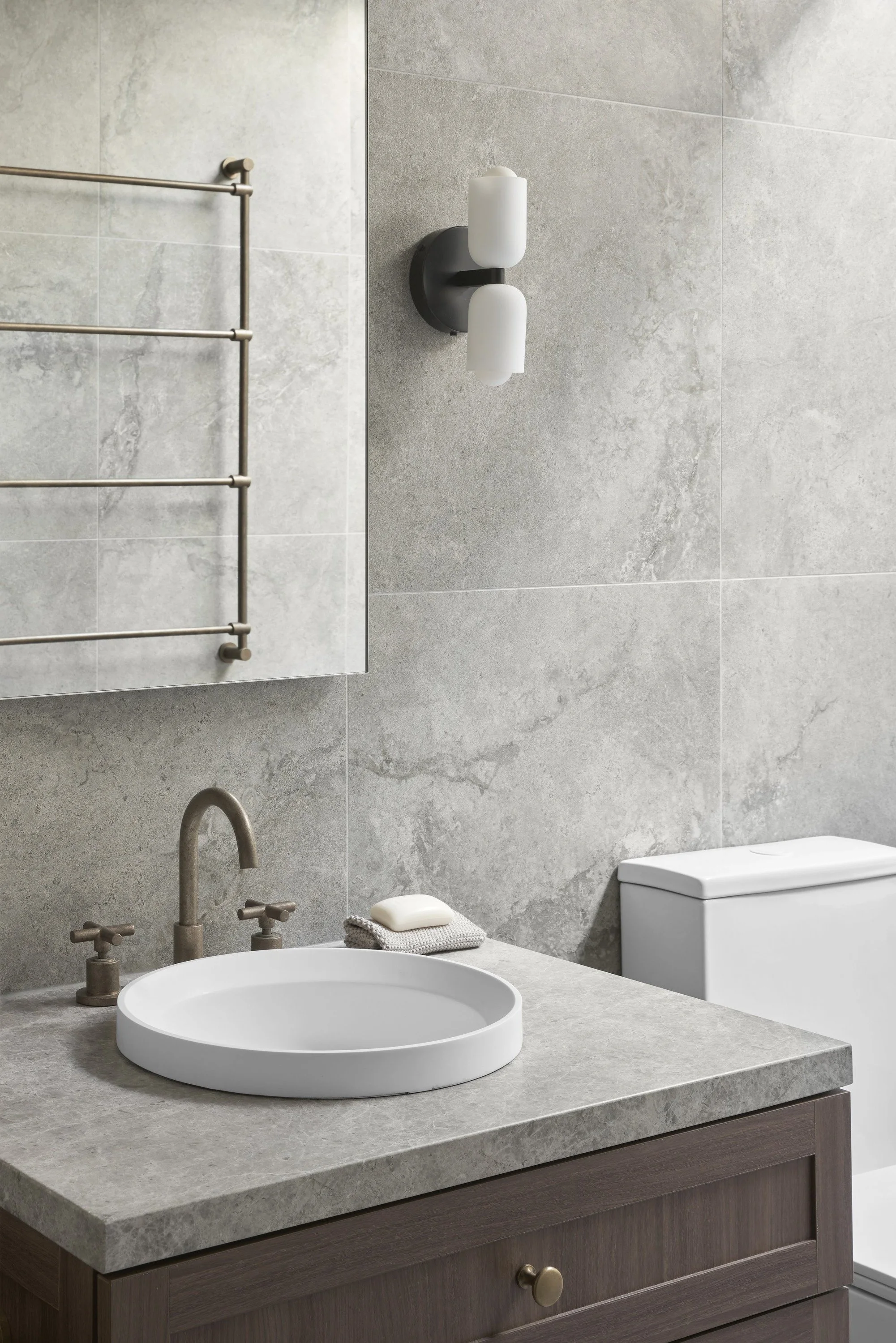 Richmond House bathroom vanity with grey stone top, round basin and towel rail