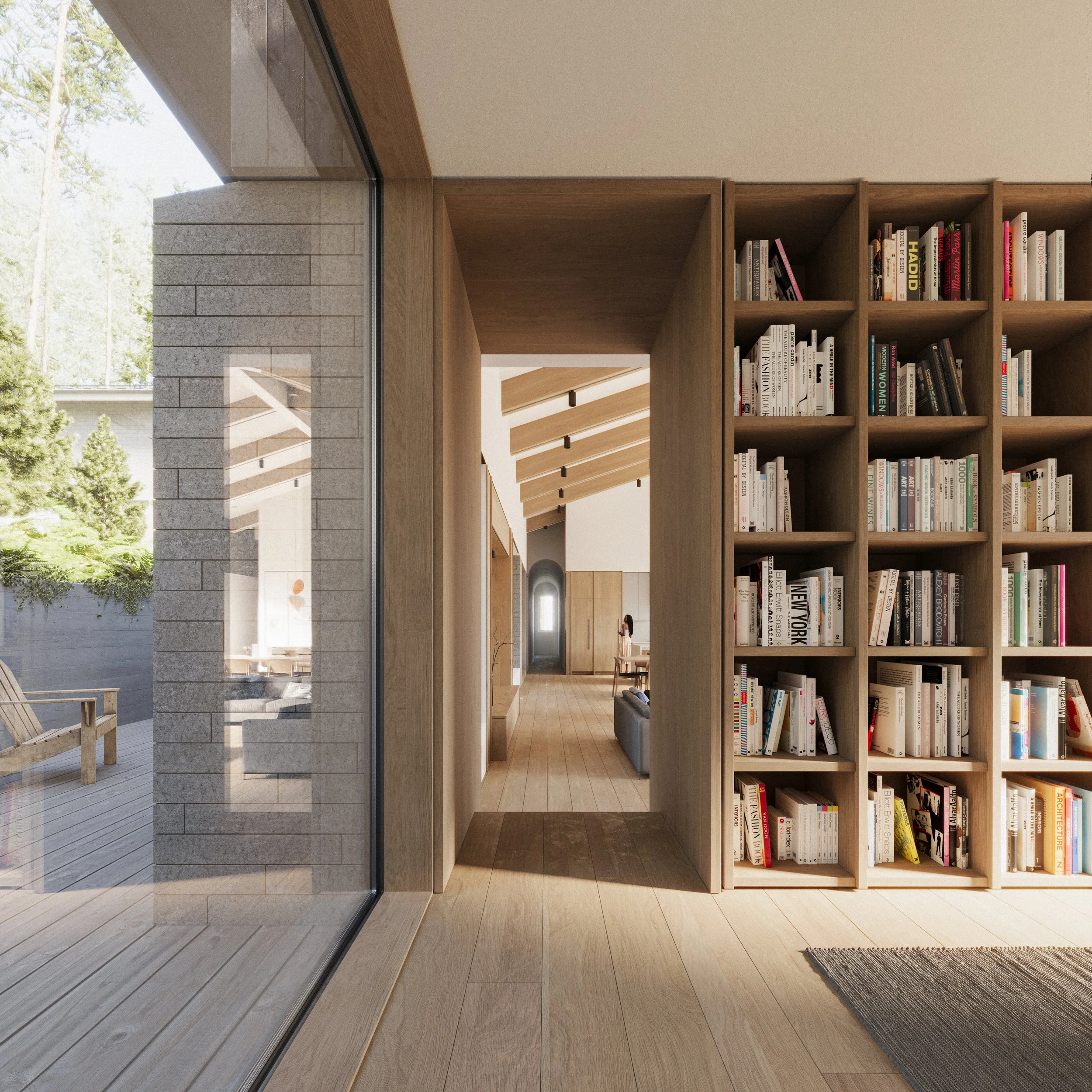 Interior of a custom home in Nova Scotia with natural light, custom bookshelves, and wood floors