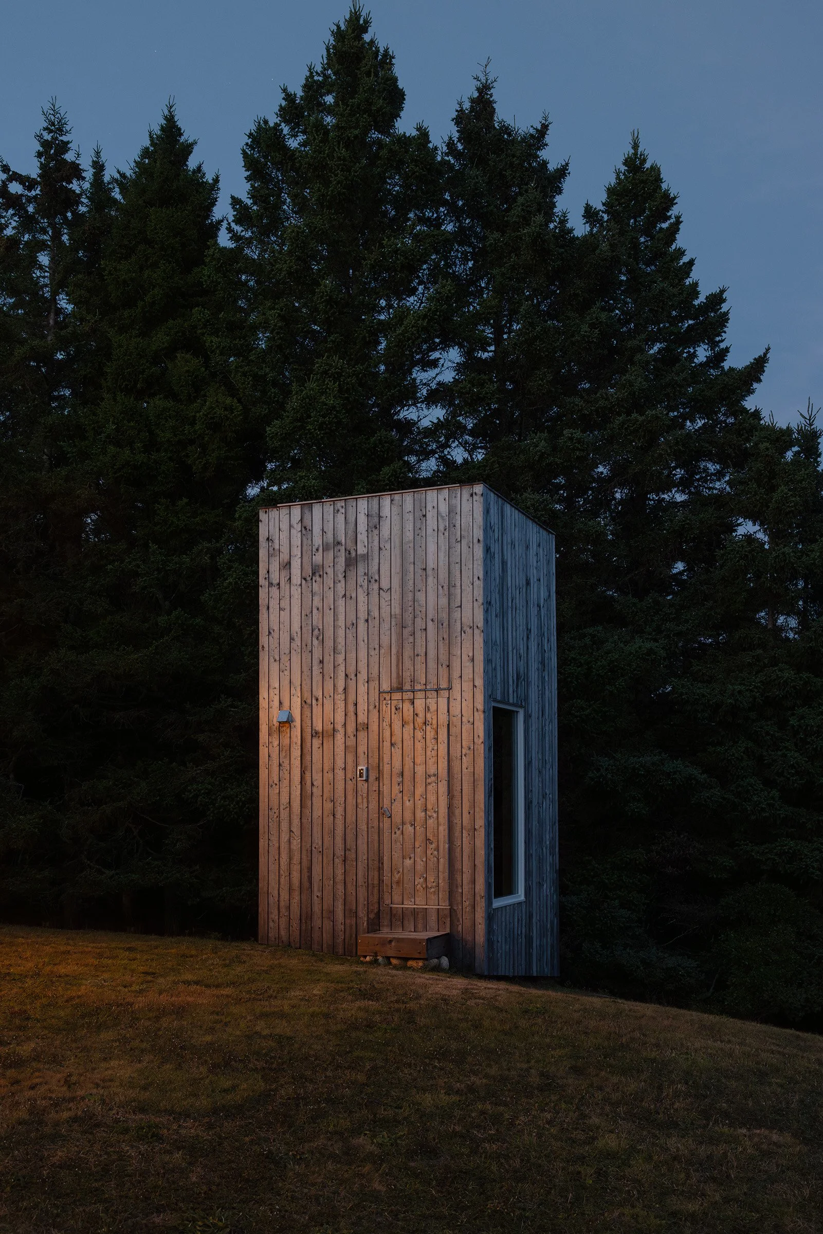 Sauna exterior in Nova Scotia at sunset featuring cedar wood cladding